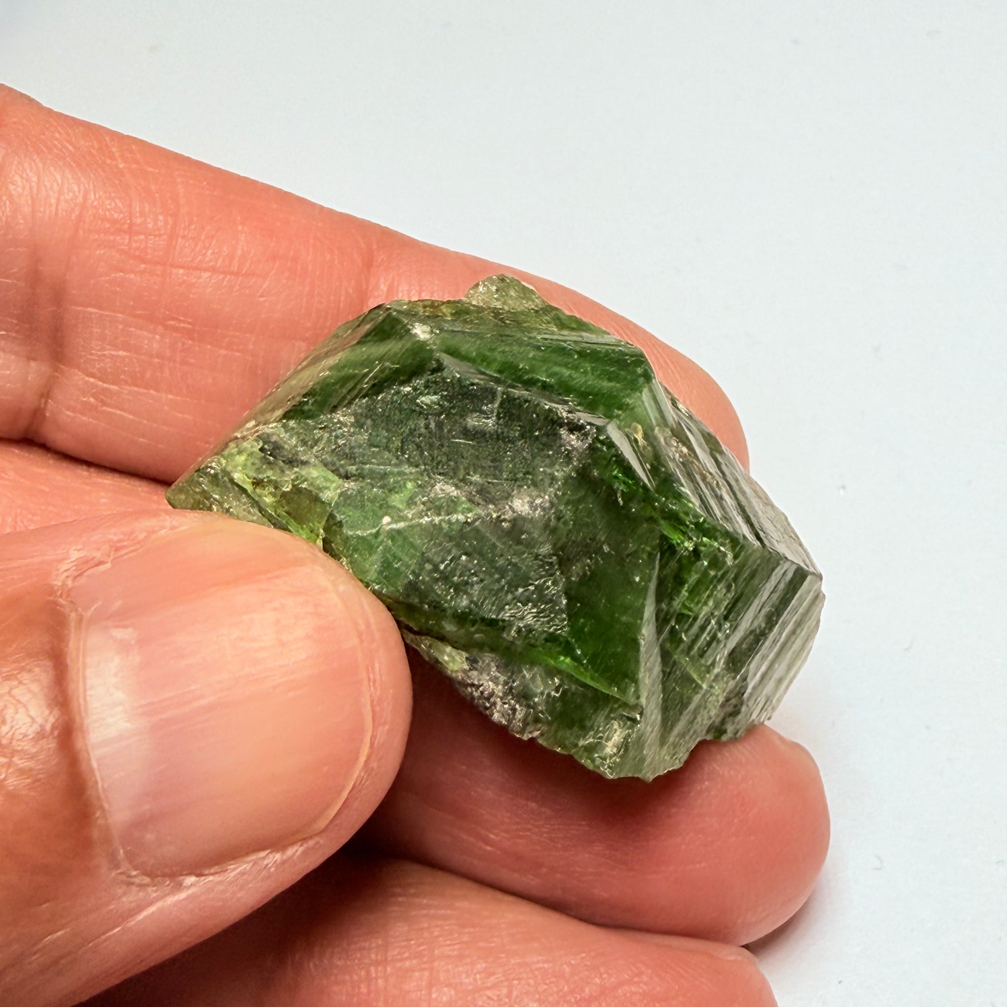 Tsavorite Crystal, 19.90gm / 99.50ct, Merelani. Tanzania, only the front is crystalized, but make a great specimen or set it in jewellery as is