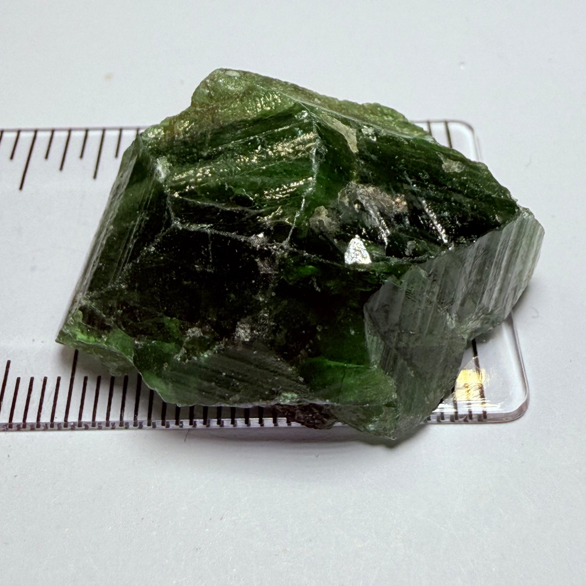 Tsavorite Crystal, 19.90gm / 99.50ct, Merelani. Tanzania, only the front is crystalized, but make a great specimen or set it in jewellery as is