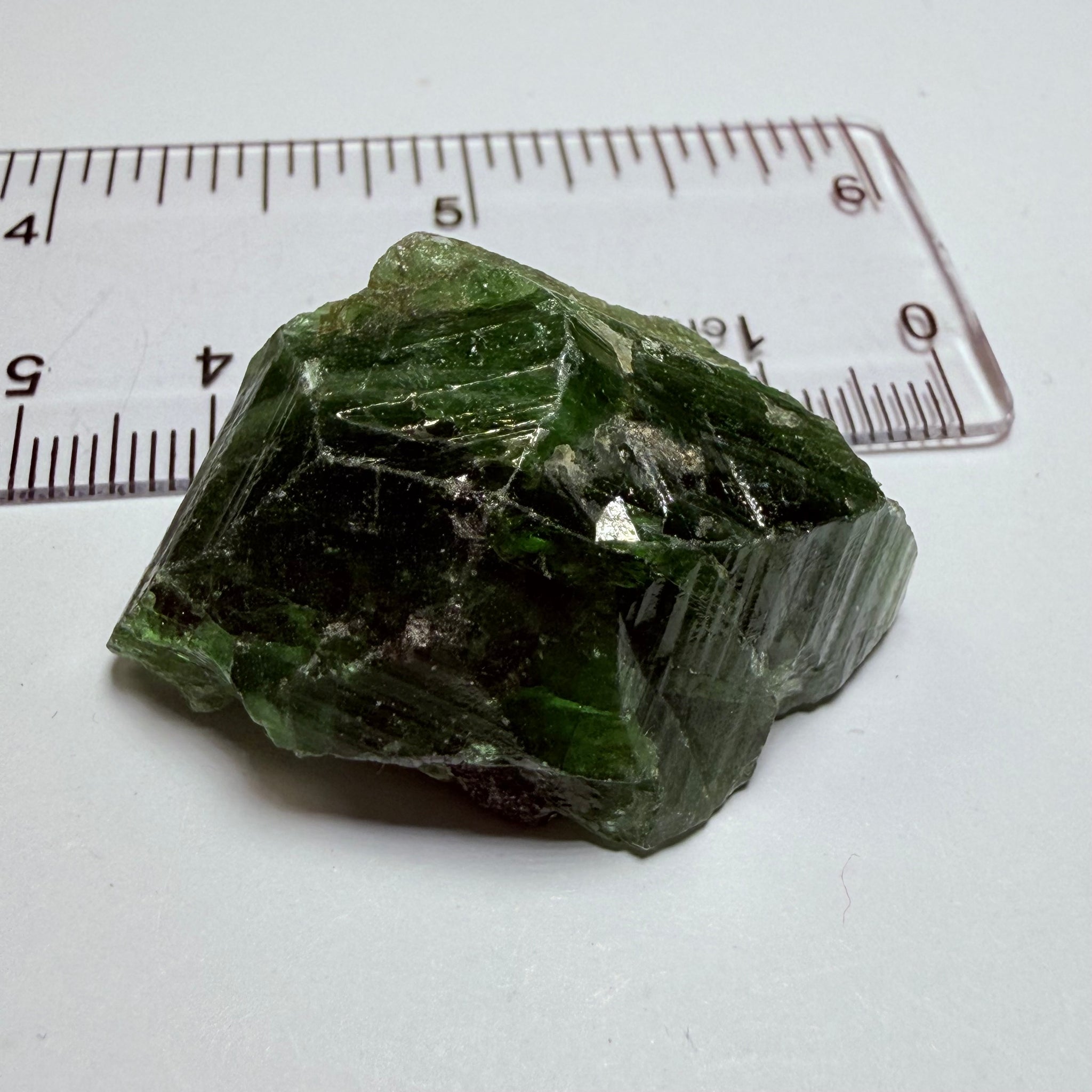 Tsavorite Crystal, 19.90gm / 99.50ct, Merelani. Tanzania, only the front is crystalized, but make a great specimen or set it in jewellery as is