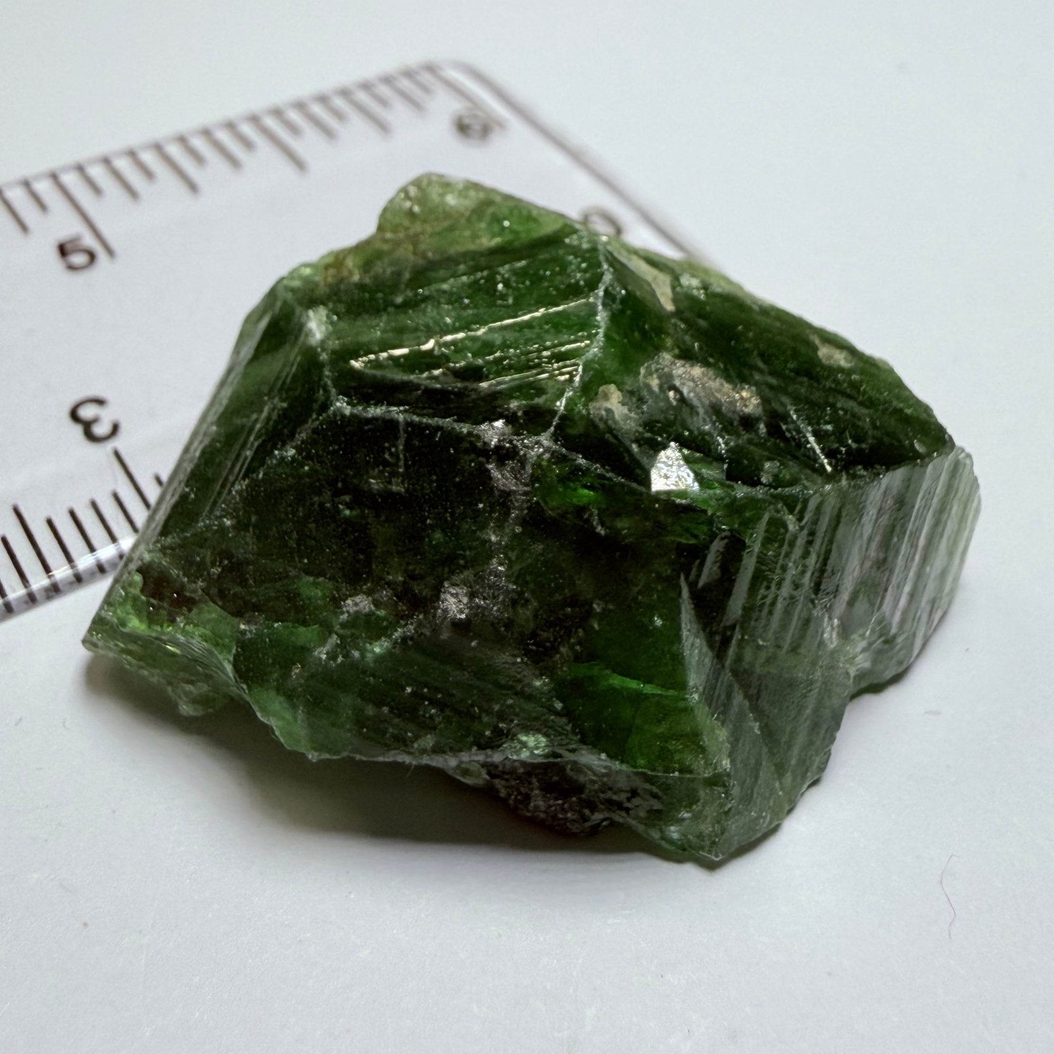 Tsavorite Crystal, 19.90gm / 99.50ct, Merelani. Tanzania, only the front is crystalized, but make a great specimen or set it in jewellery as is