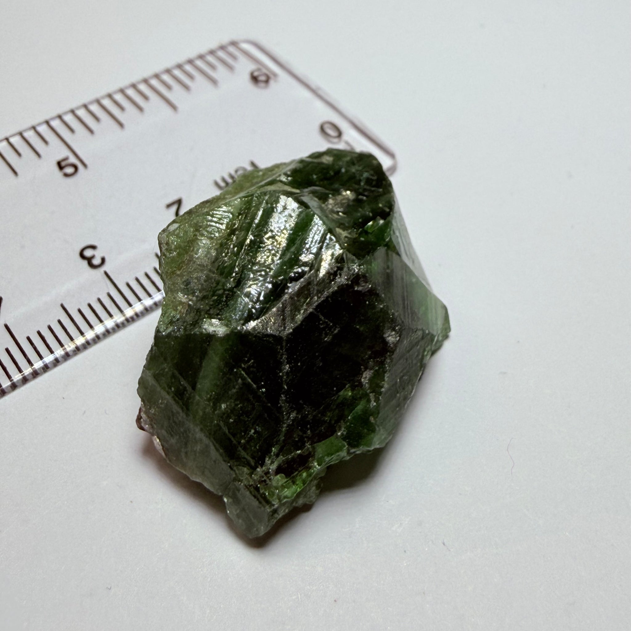 Tsavorite Crystal, 19.90gm / 99.50ct, Merelani. Tanzania, only the front is crystalized, but make a great specimen or set it in jewellery as is