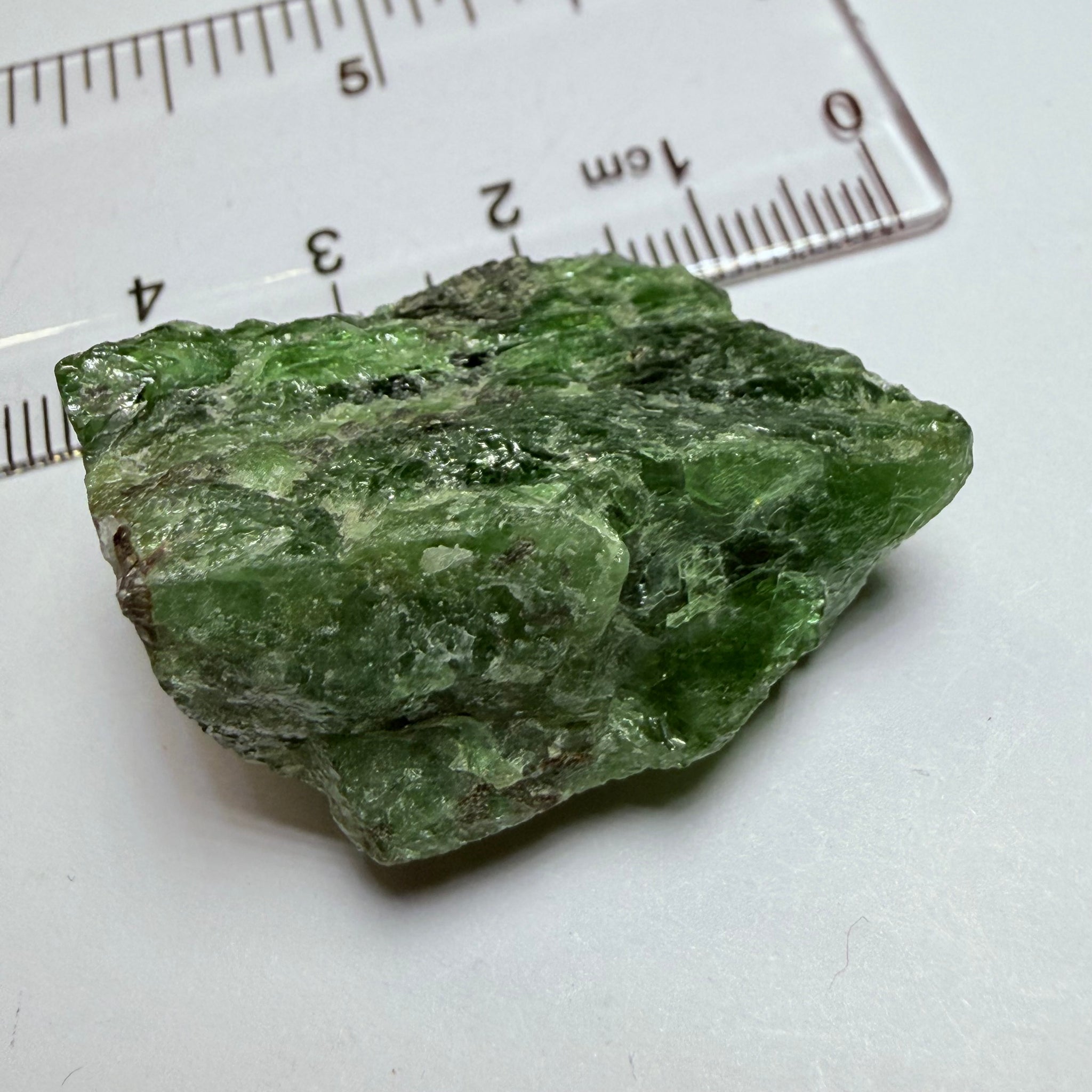 Tsavorite Crystal, 19.90gm / 99.50ct, Merelani. Tanzania, only the front is crystalized, but make a great specimen or set it in jewellery as is