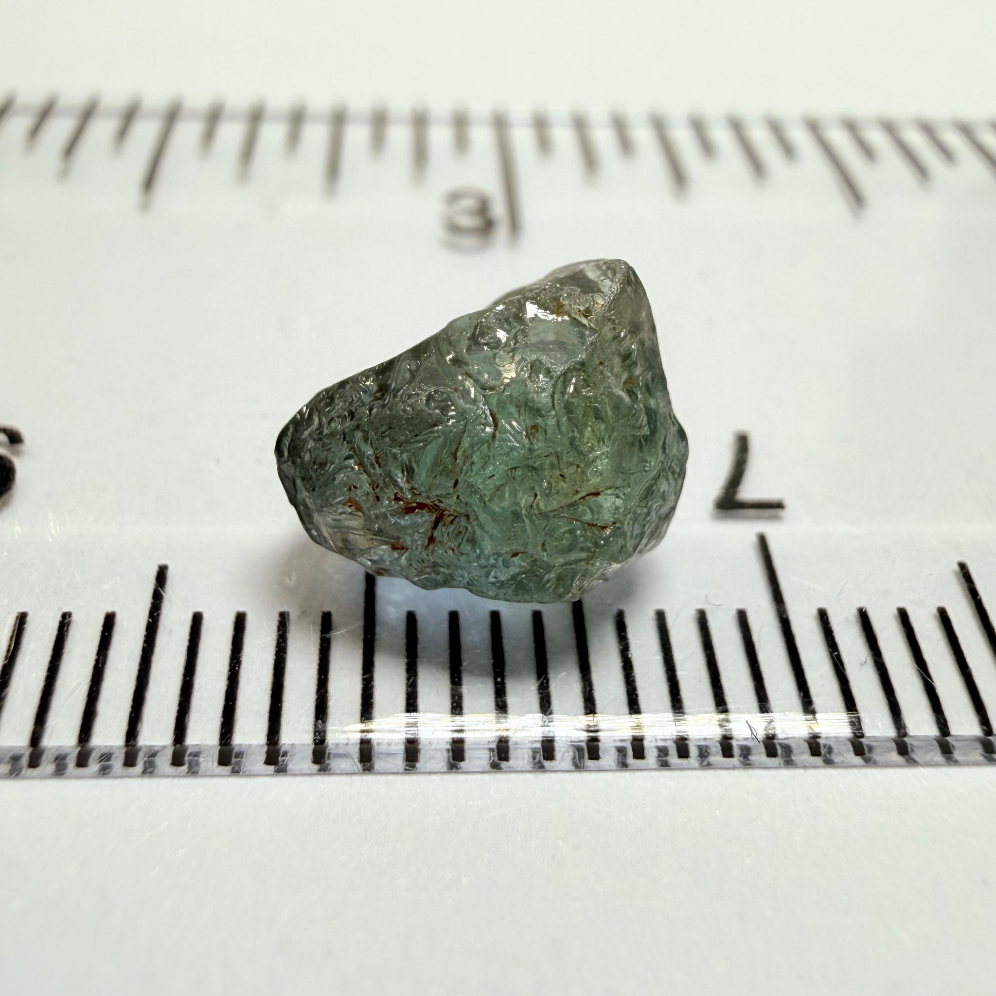 Umba Sapphire, 3.84ct, Umba Valley, Tanzania, Untreated Unheated. Moderately included with a crack coming in 2mm on the side rest has white crystal inclusions and silk