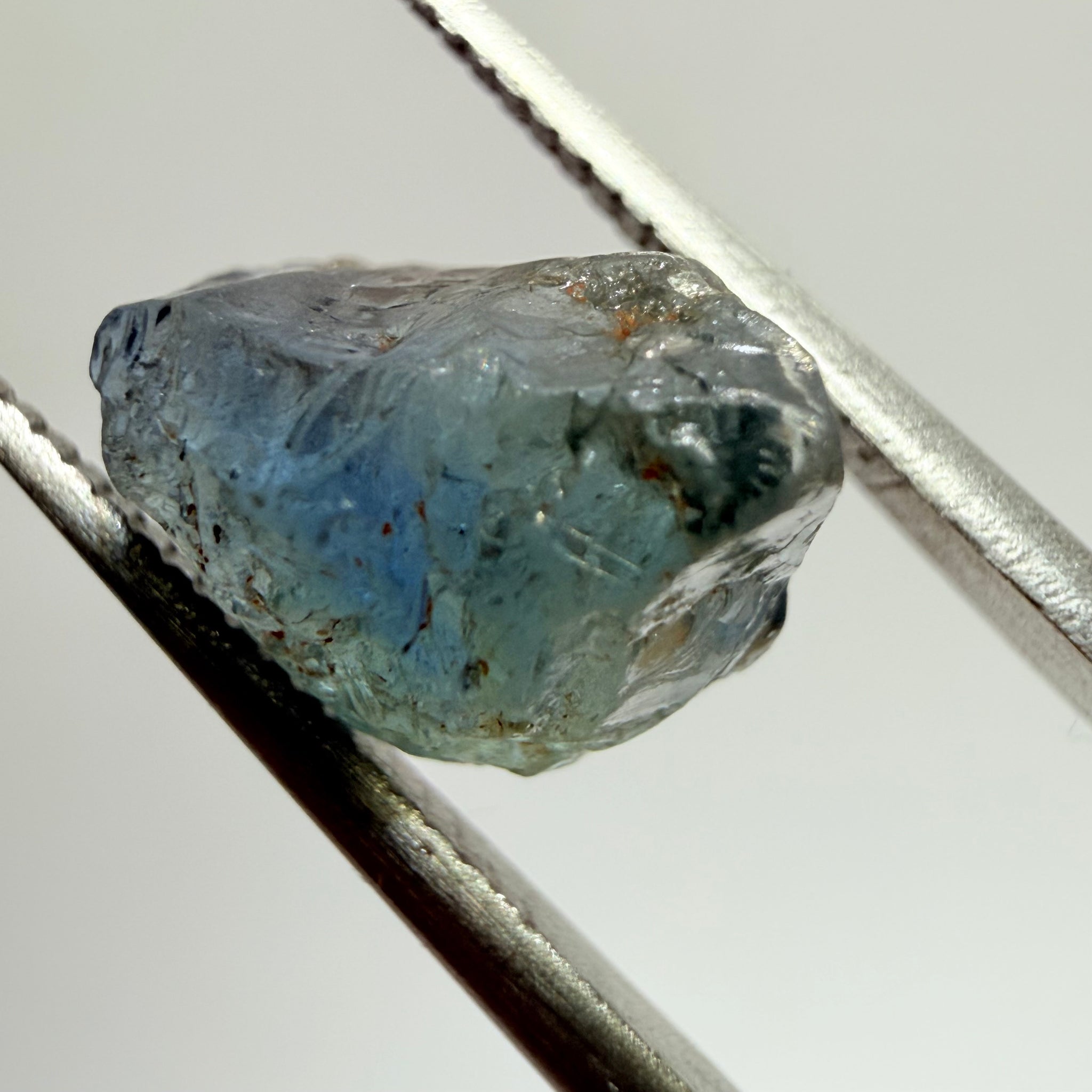 Umba Sapphire, 3.84ct, Umba Valley, Tanzania, Untreated Unheated. Moderately included with a crack coming in 2mm on the side rest has white crystal inclusions and silk