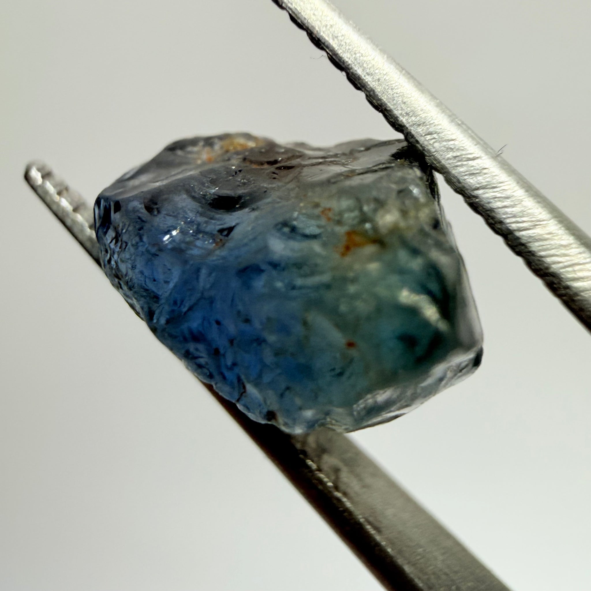 Umba Sapphire, 3.84ct, Umba Valley, Tanzania, Untreated Unheated. Moderately included with a crack coming in 2mm on the side rest has white crystal inclusions and silk