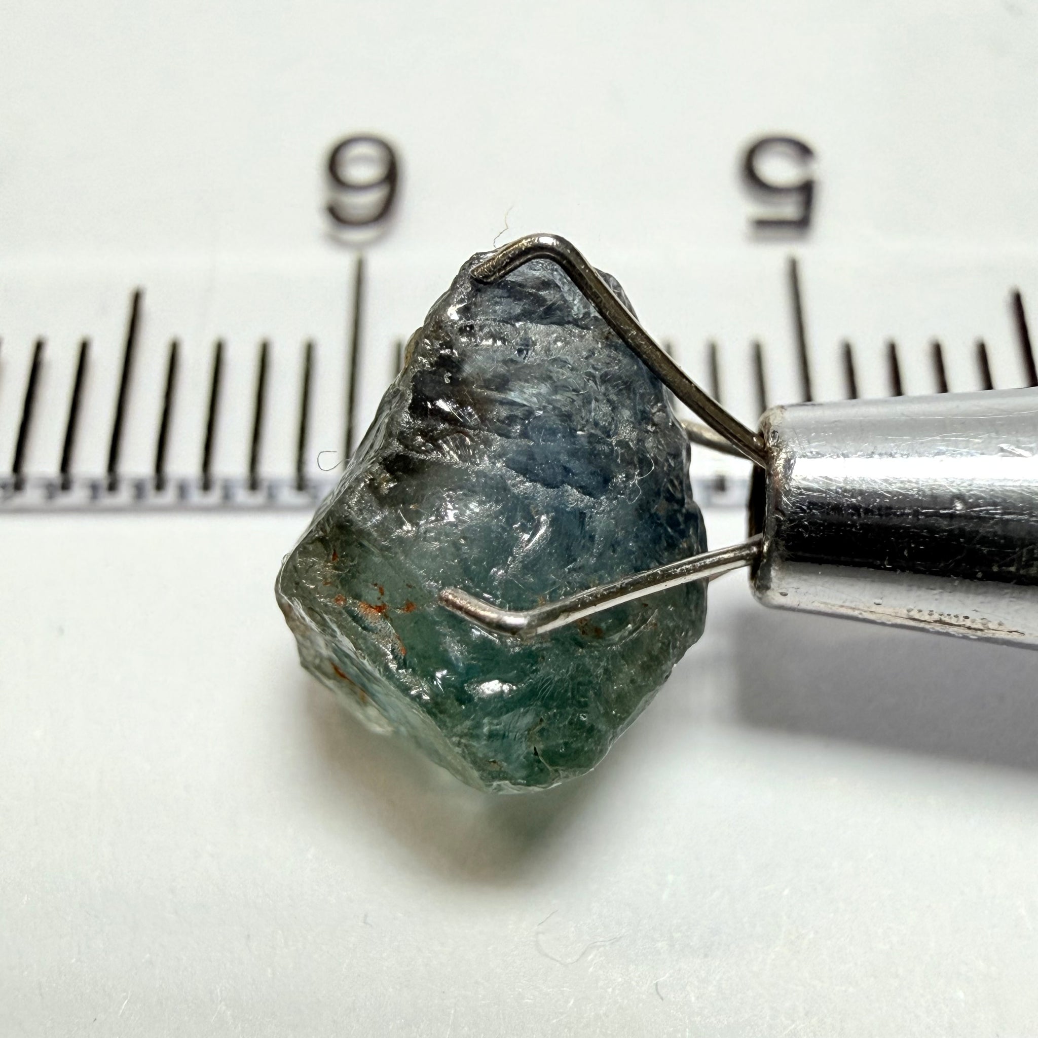 Umba Sapphire, 3.84ct, Umba Valley, Tanzania, Untreated Unheated. Moderately included with a crack coming in 2mm on the side rest has white crystal inclusions and silk
