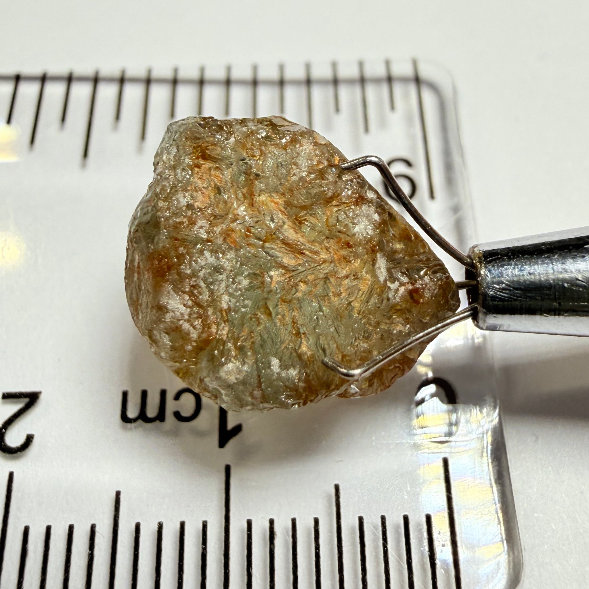 Umba Sapphire, 14.22ct, Umba Valley, Tanzania, Untreated Unheated. Very slight inclusion on the outside skin that will need to be removed before faceting, rest are needles, see videos backlit
