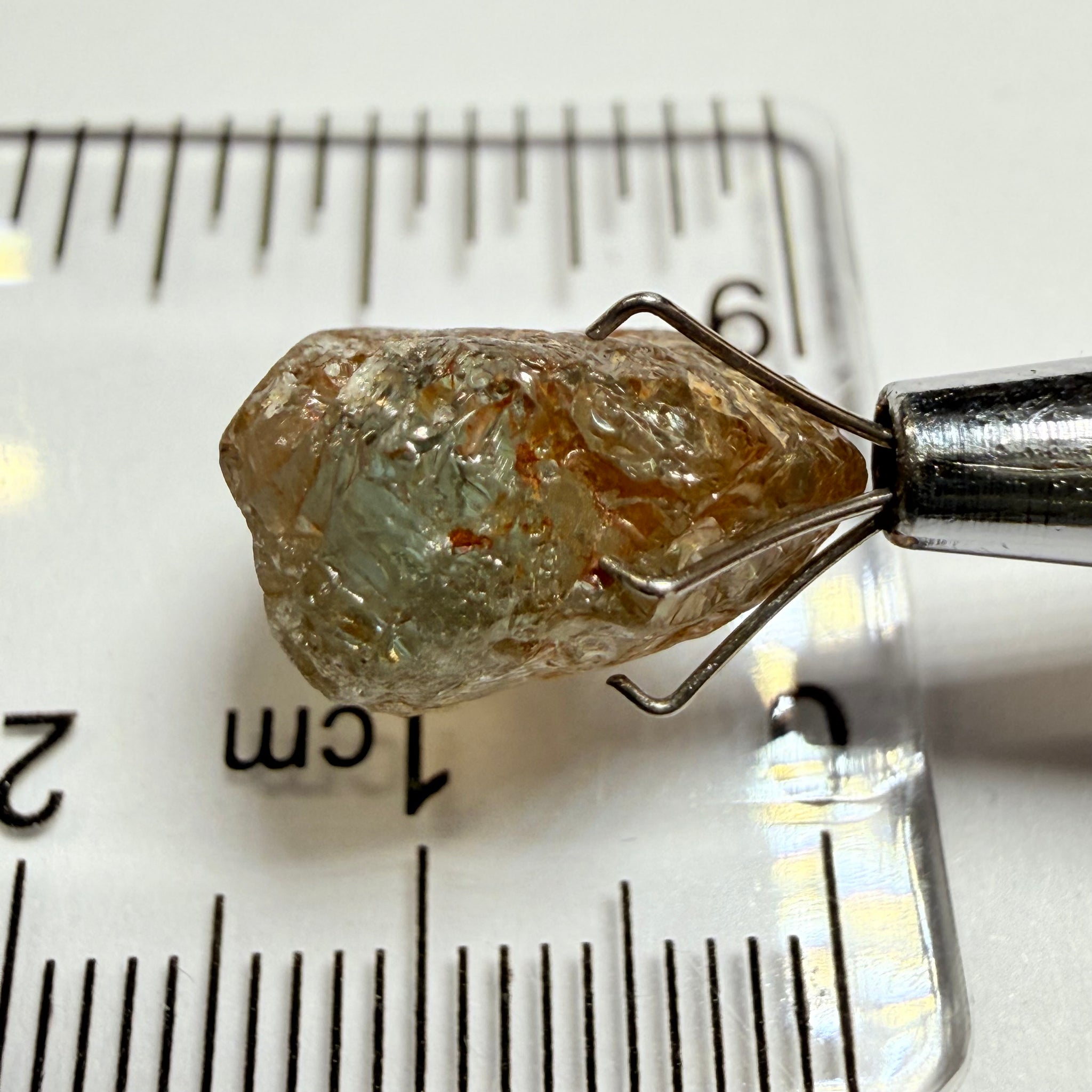 Umba Sapphire, 14.22ct, Umba Valley, Tanzania, Untreated Unheated. Very slight inclusion on the outside skin that will need to be removed before faceting, rest are needles, see videos backlit