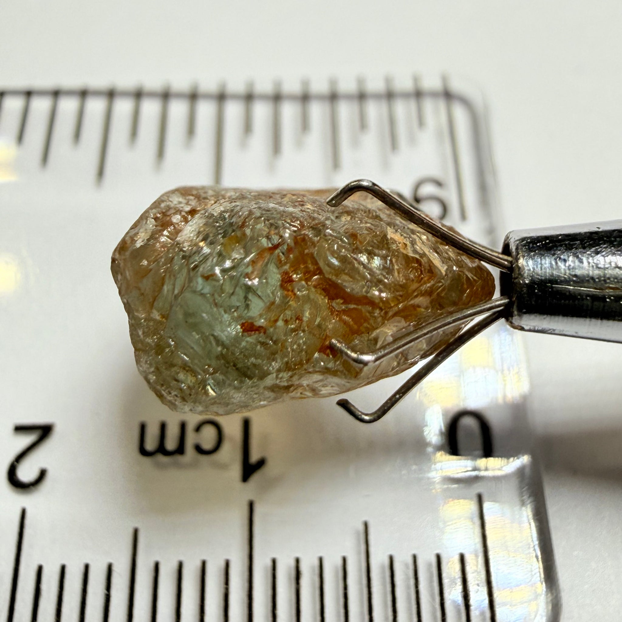 Umba Sapphire, 14.22ct, Umba Valley, Tanzania, Untreated Unheated. Very slight inclusion on the outside skin that will need to be removed before faceting, rest are needles, see videos backlit