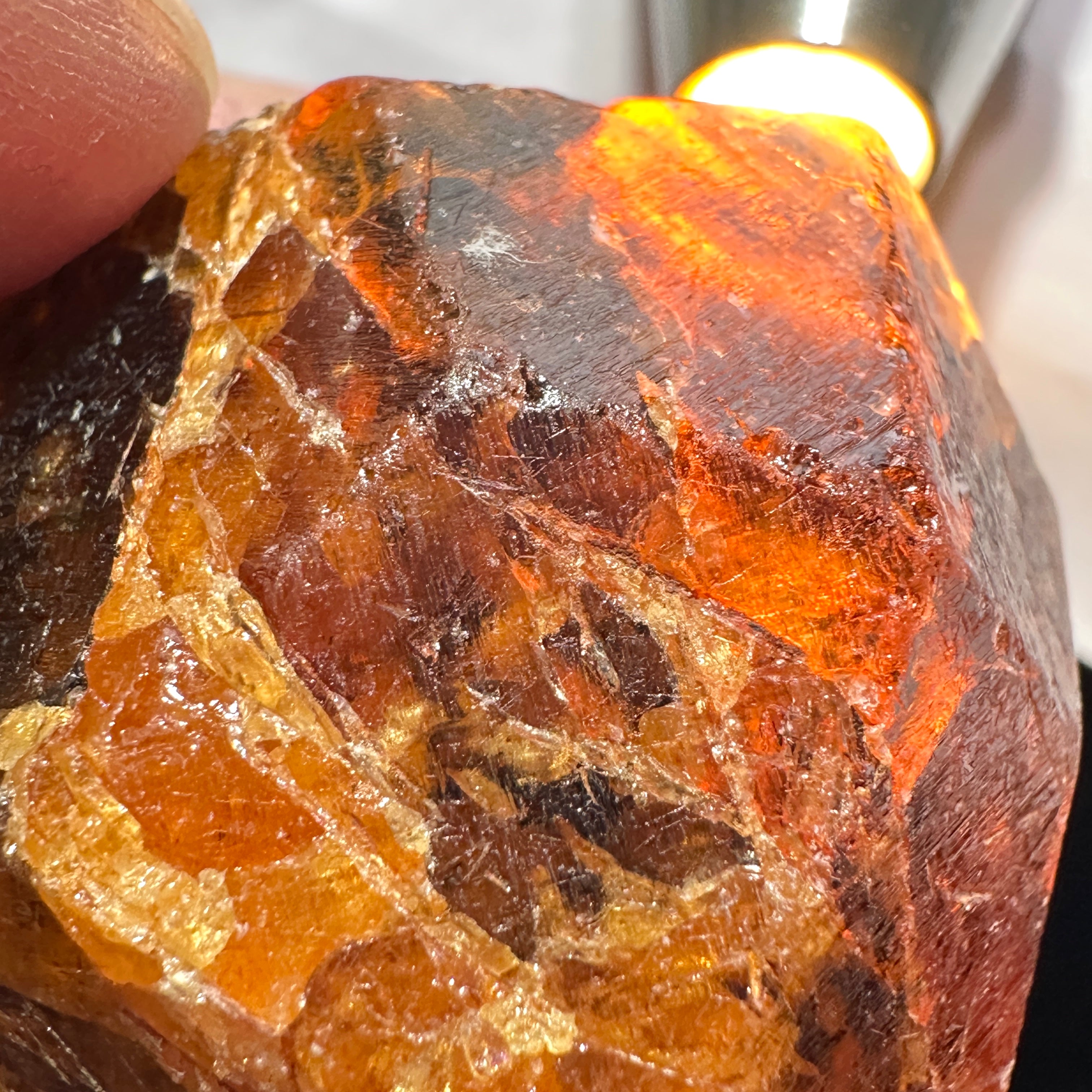 120gm / 600.00cts Large Mandarin Spessartite Garnet 41 X 38 X 38 mm, Untreated Unheated, Tanzania. Bit dark but is full of faceting grade portions see backlit photos, would normally have been broken for its faceting rough