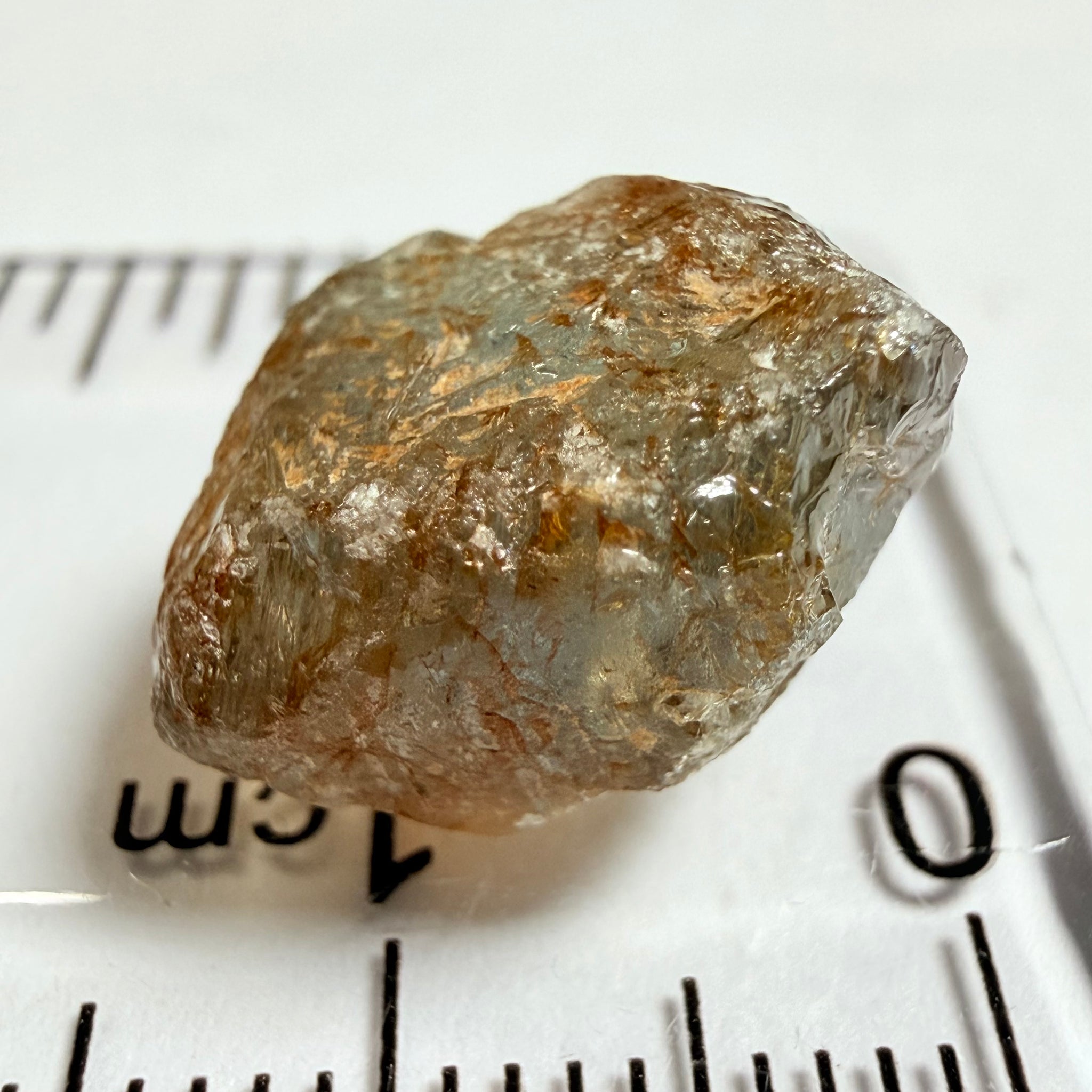 Umba Sapphire, 14.22ct, Umba Valley, Tanzania, Untreated Unheated. Very slight inclusion on the outside skin that will need to be removed before faceting, rest are needles, see videos backlit