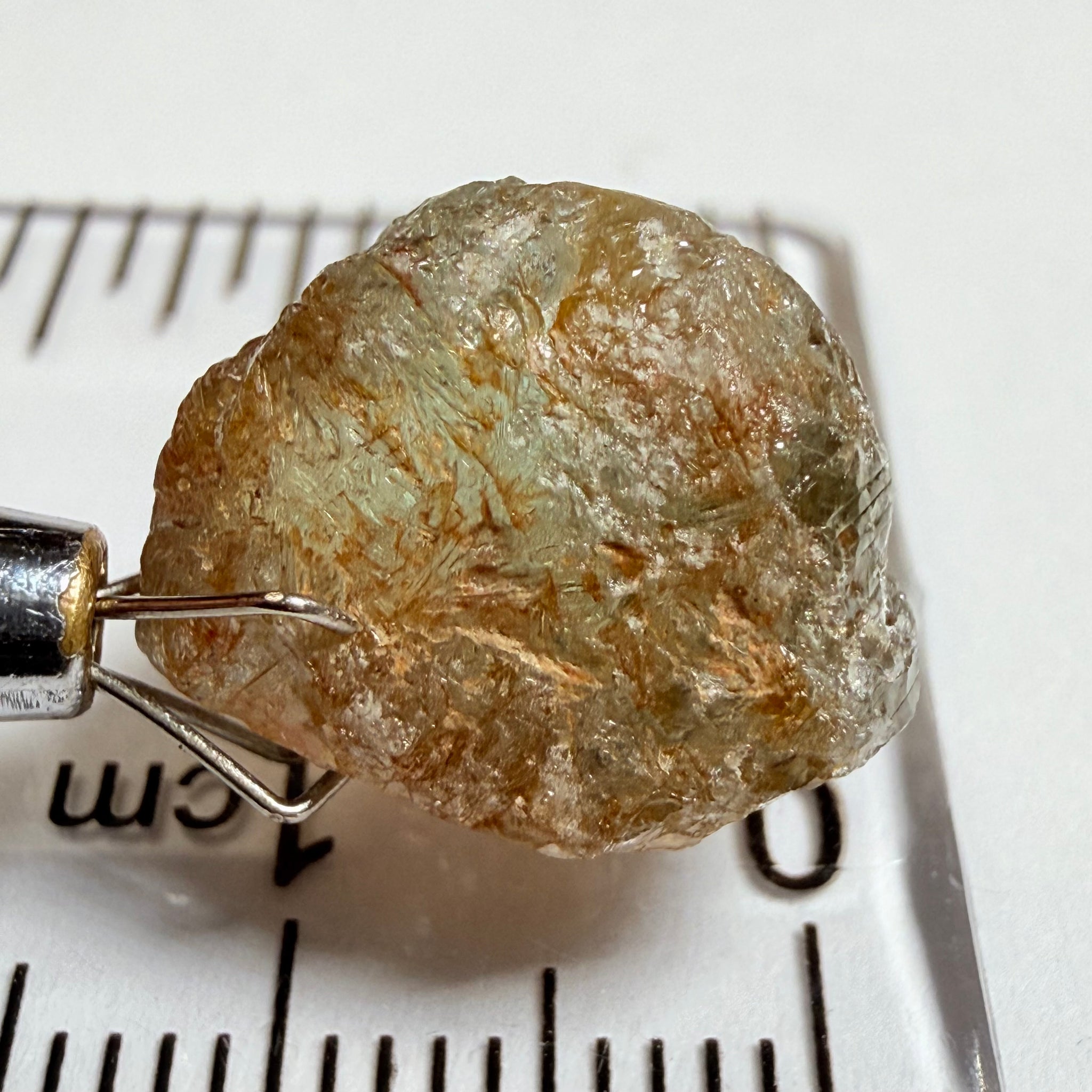 Umba Sapphire, 14.22ct, Umba Valley, Tanzania, Untreated Unheated. Very slight inclusion on the outside skin that will need to be removed before faceting, rest are needles, see videos backlit