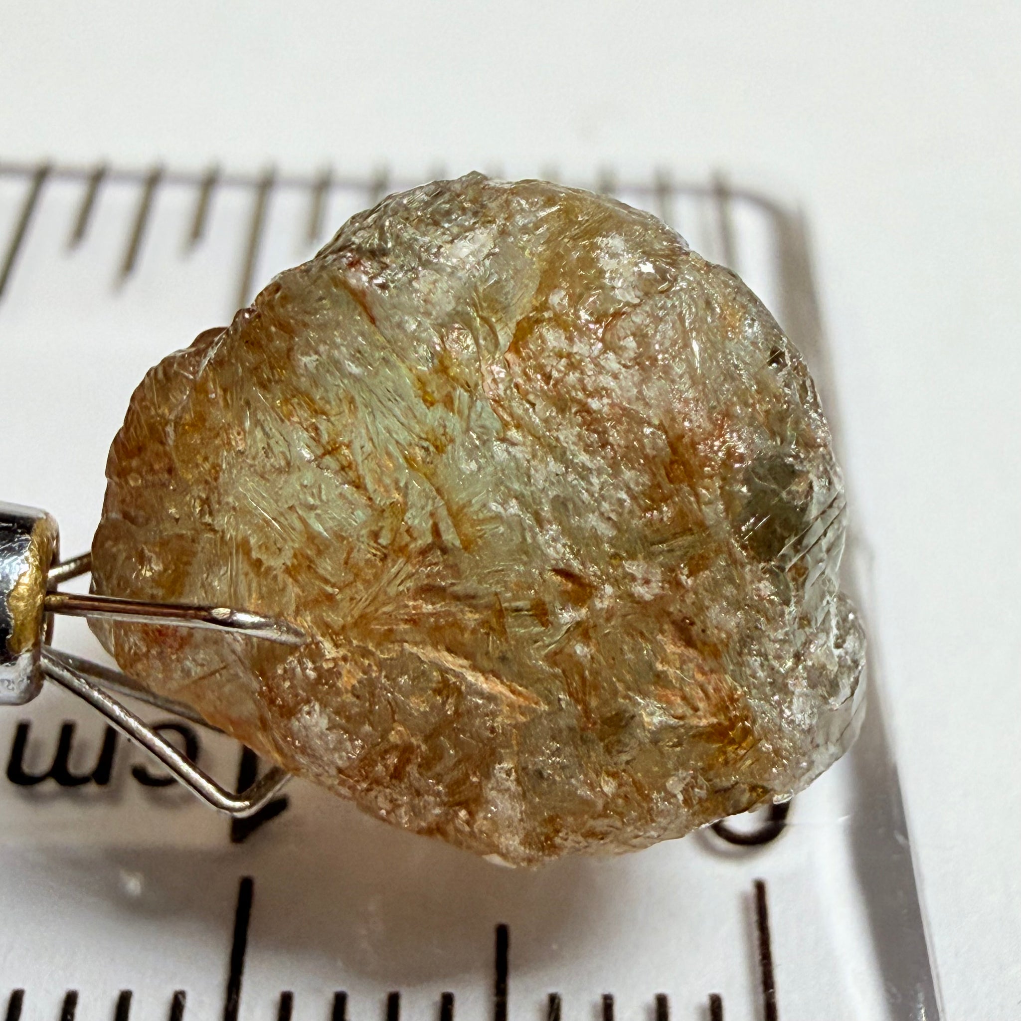 Umba Sapphire, 14.22ct, Umba Valley, Tanzania, Untreated Unheated. Very slight inclusion on the outside skin that will need to be removed before faceting, rest are needles, see videos backlit