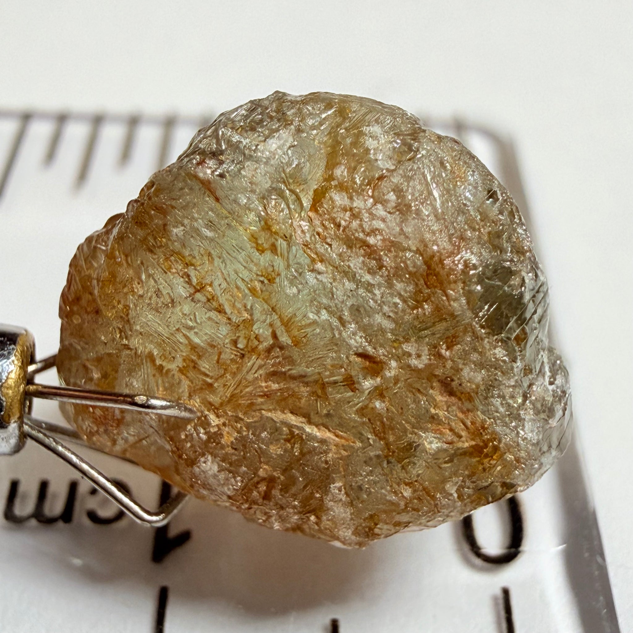 Umba Sapphire, 14.22ct, Umba Valley, Tanzania, Untreated Unheated. Very slight inclusion on the outside skin that will need to be removed before faceting, rest are needles, see videos backlit