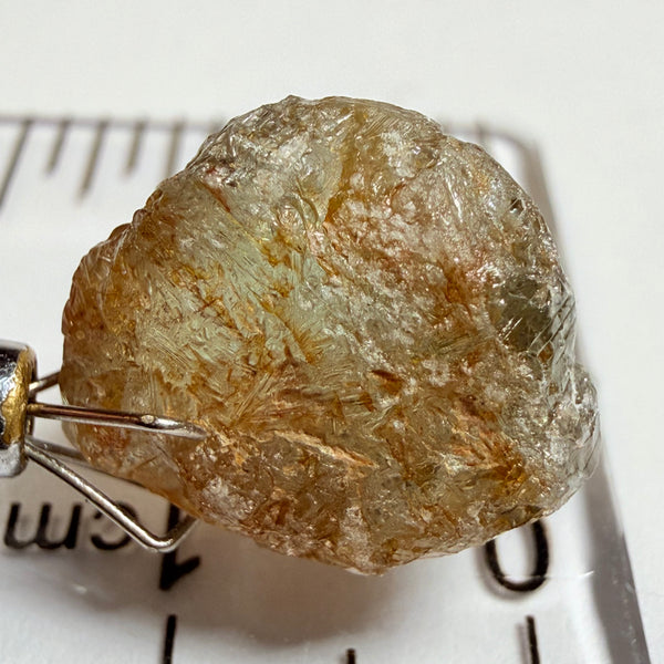 Umba Sapphire, 14.22ct, Umba Valley, Tanzania, Untreated Unheated. Very slight inclusion on the outside skin that will need to be removed before faceting, rest are needles, see videos backlit