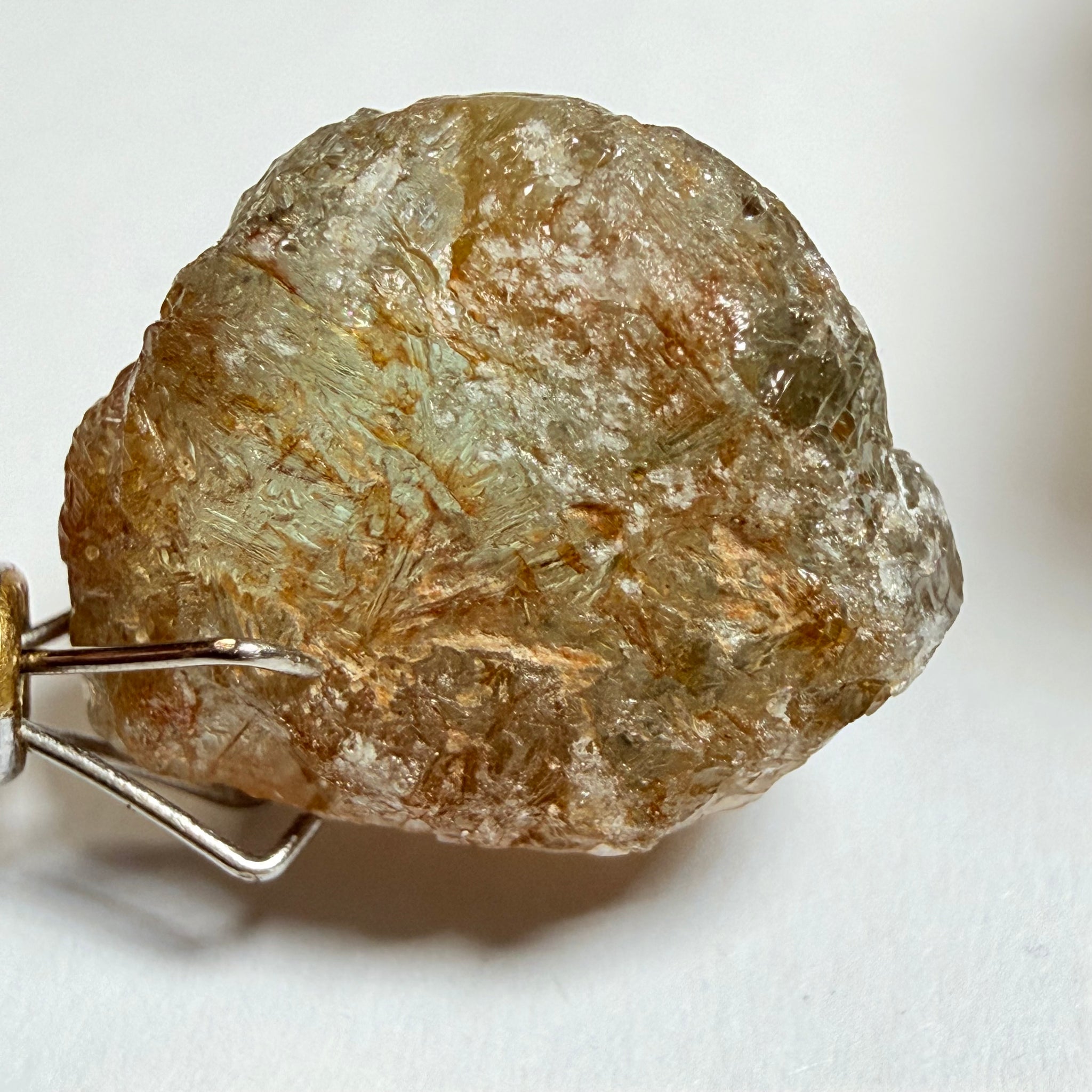 Umba Sapphire, 14.22ct, Umba Valley, Tanzania, Untreated Unheated. Very slight inclusion on the outside skin that will need to be removed before faceting, rest are needles, see videos backlit