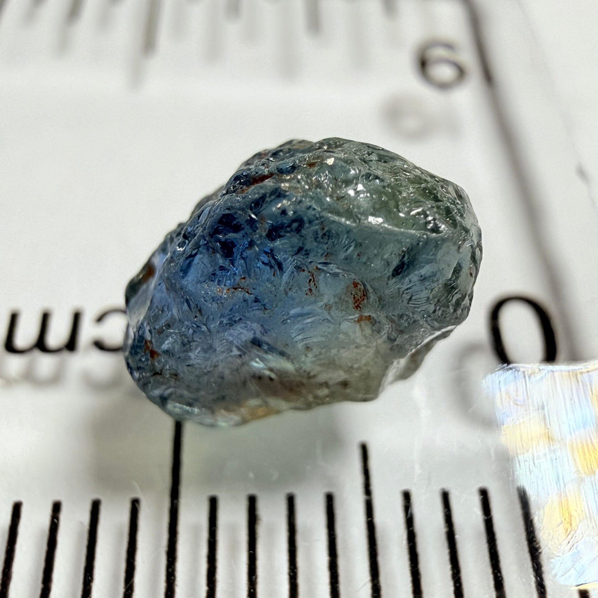 Umba Sapphire, 3.84ct, Umba Valley, Tanzania, Untreated Unheated. Moderately included with a crack coming in 2mm on the side rest has white crystal inclusions and silk