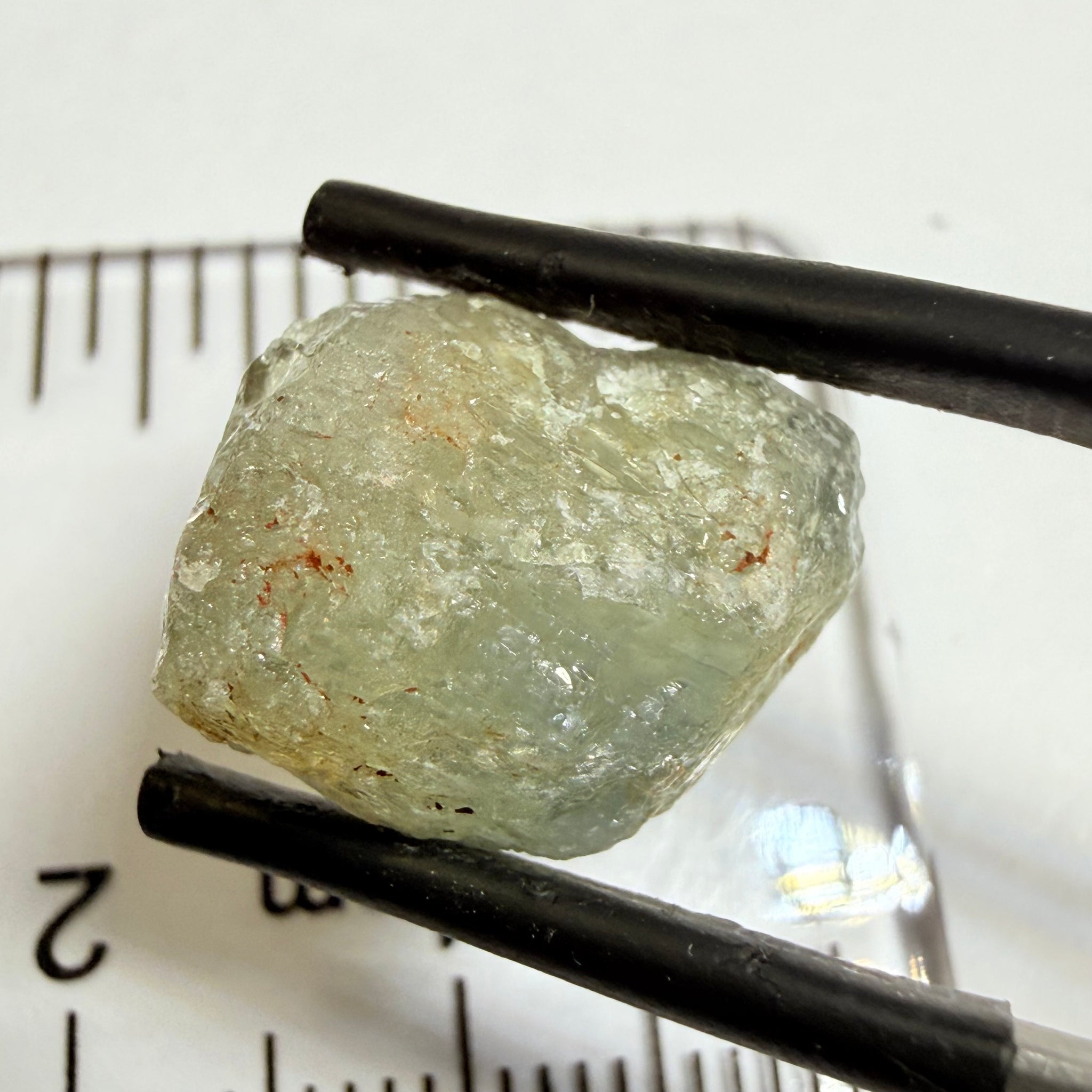 Umba Sapphire, 14.72ct, Umba Valley, Tanzania, Untreated Unheated. Slightly to moderately included,  slight silk, crack going a 1/4 way in. See the backlit pics  I have circled the crack, minor fissures to be removed before faceting