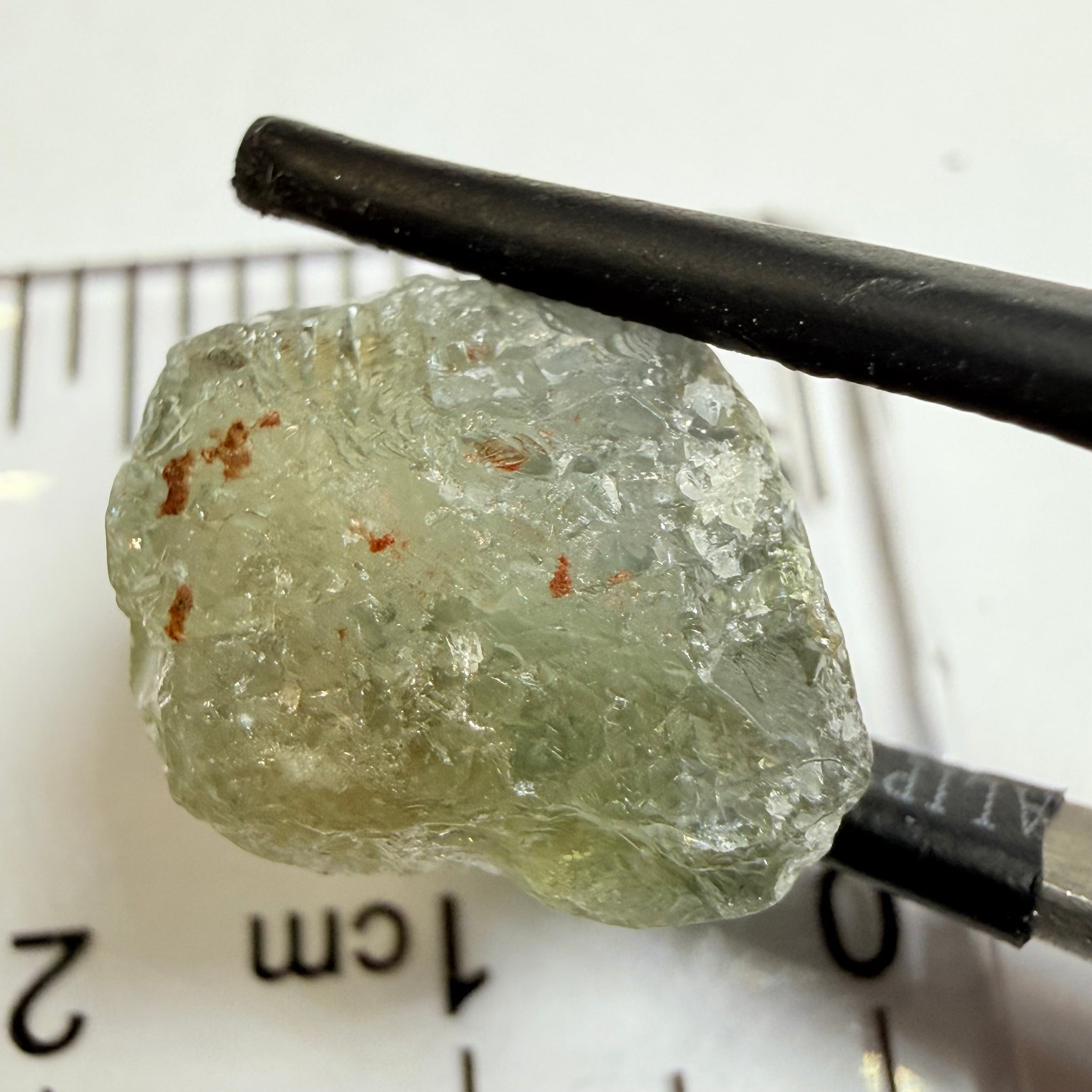 Umba Sapphire, 14.72ct, Umba Valley, Tanzania, Untreated Unheated. Slightly to moderately included,  slight silk, crack going a 1/4 way in. See the backlit pics  I have circled the crack, minor fissures to be removed before faceting