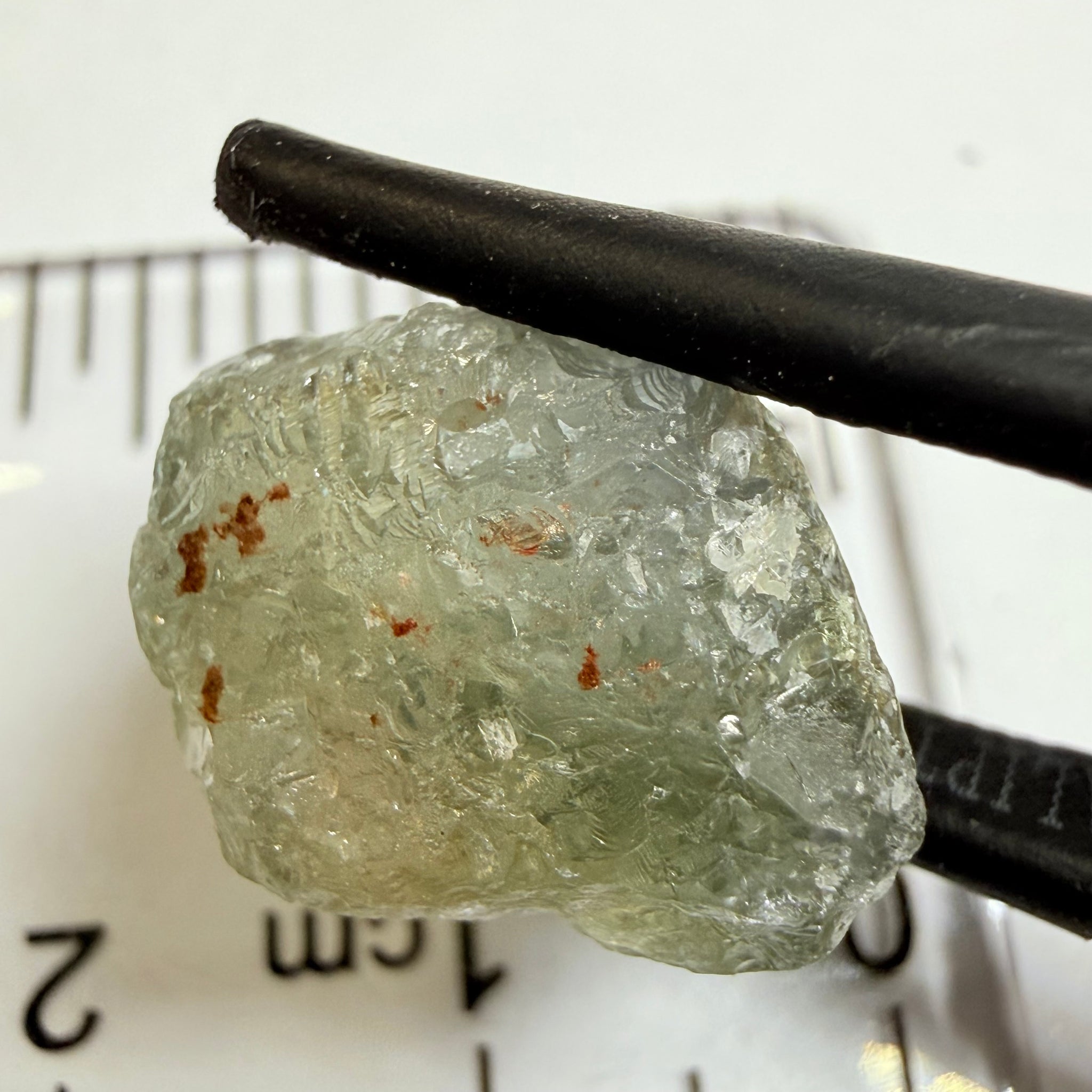Umba Sapphire, 14.72ct, Umba Valley, Tanzania, Untreated Unheated. Slightly to moderately included,  slight silk, crack going a 1/4 way in. See the backlit pics  I have circled the crack, minor fissures to be removed before faceting