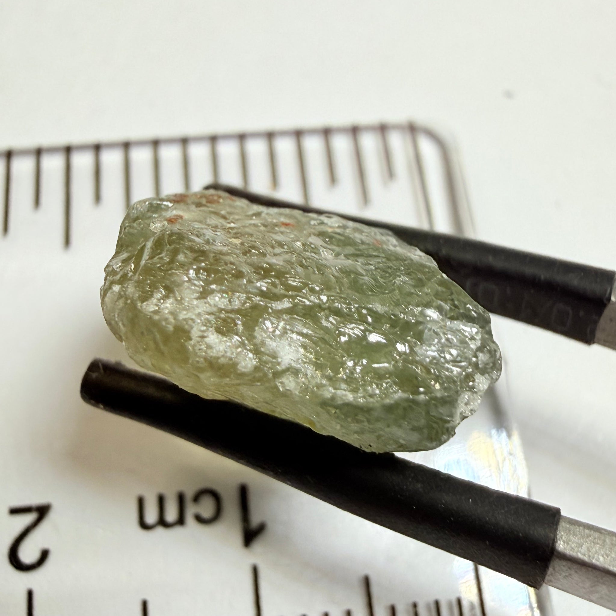 Umba Sapphire, 14.72ct, Umba Valley, Tanzania, Untreated Unheated. Slightly to moderately included,  slight silk, crack going a 1/4 way in. See the backlit pics  I have circled the crack, minor fissures to be removed before faceting