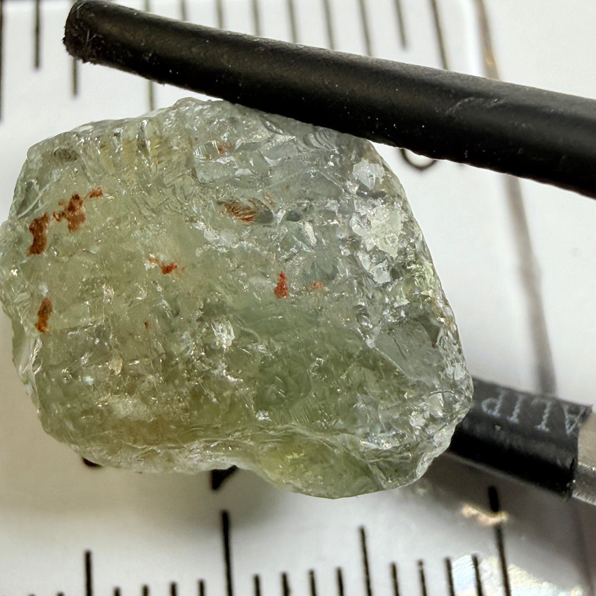 Umba Sapphire, 14.72ct, Umba Valley, Tanzania, Untreated Unheated. Slightly to moderately included,  slight silk, crack going a 1/4 way in. See the backlit pics  I have circled the crack, minor fissures to be removed before faceting