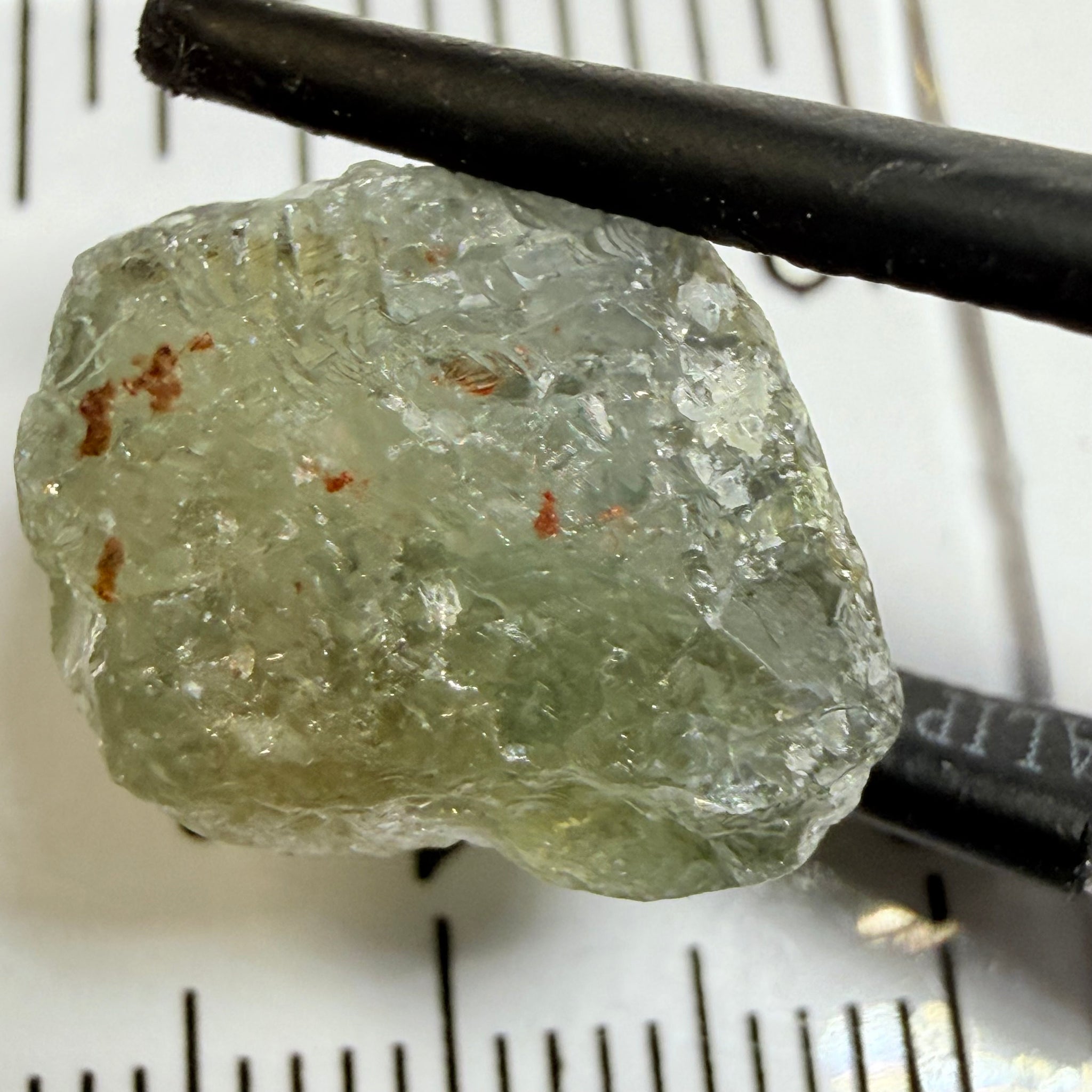 Umba Sapphire, 14.72ct, Umba Valley, Tanzania, Untreated Unheated. Slightly to moderately included,  slight silk, crack going a 1/4 way in. See the backlit pics  I have circled the crack, minor fissures to be removed before faceting