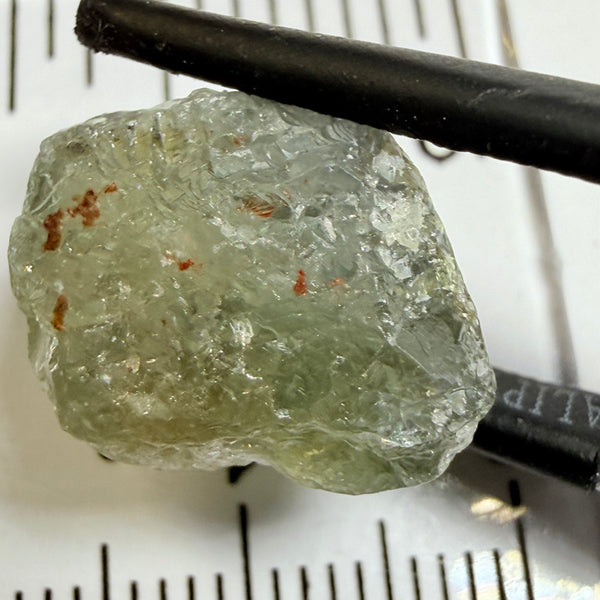Umba Sapphire, 14.72ct, Umba Valley, Tanzania, Untreated Unheated. Slightly to moderately included,  slight silk, crack going a 1/4 way in. See the backlit pics  I have circled the crack, minor fissures to be removed before faceting