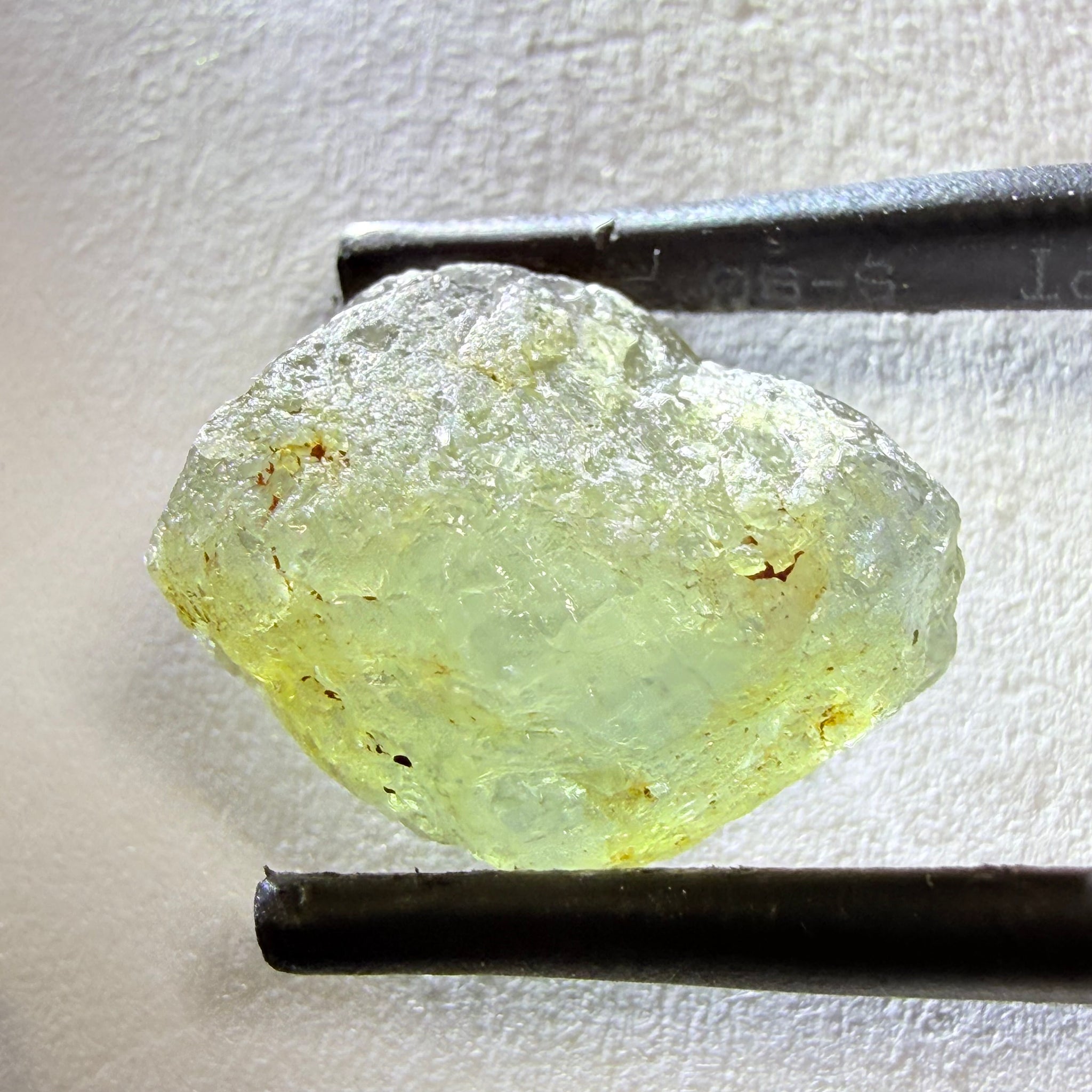 Umba Sapphire, 14.72ct, Umba Valley, Tanzania, Untreated Unheated. Slightly to moderately included,  slight silk, crack going a 1/4 way in. See the backlit pics  I have circled the crack, minor fissures to be removed before faceting