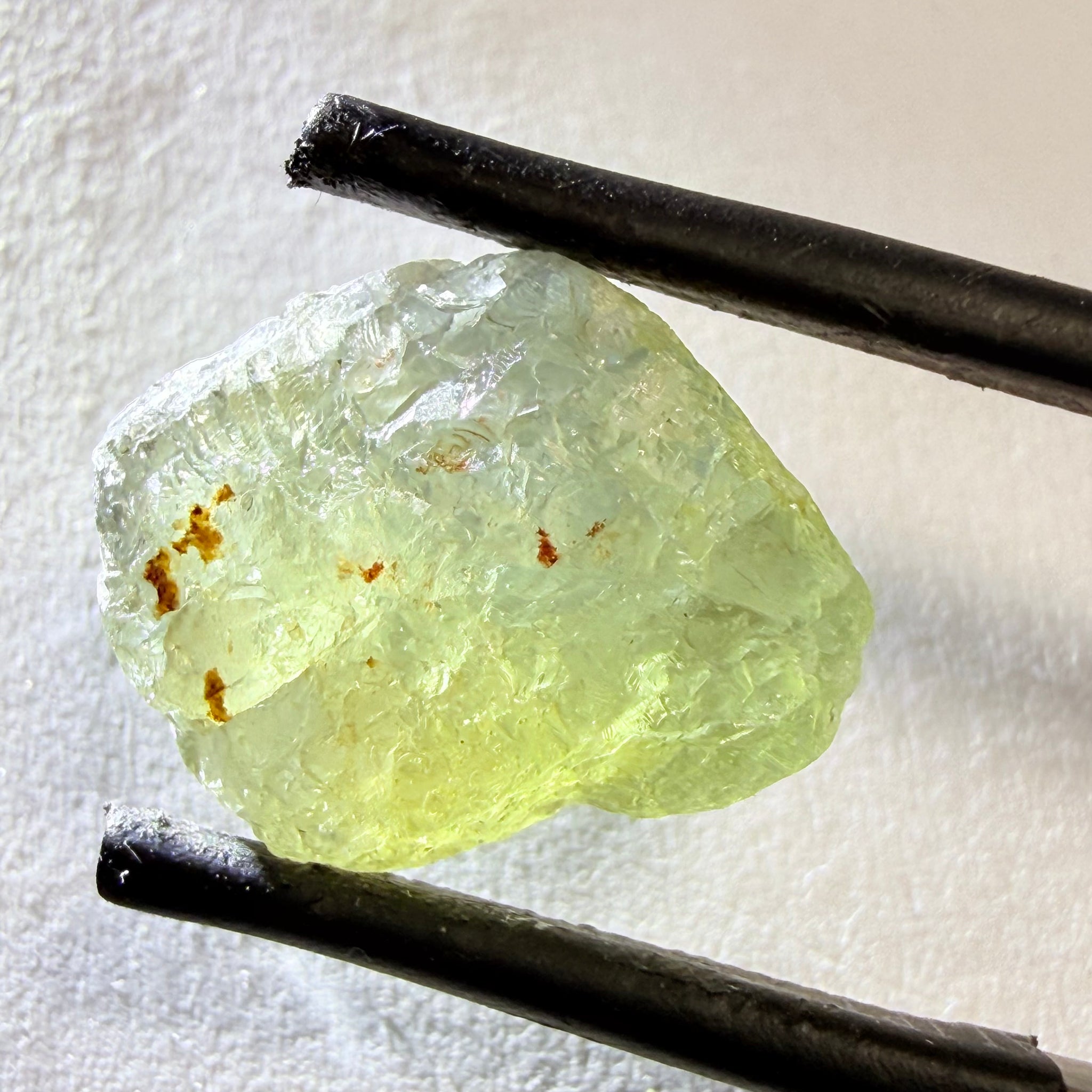 Umba Sapphire, 14.72ct, Umba Valley, Tanzania, Untreated Unheated. Slightly to moderately included,  slight silk, crack going a 1/4 way in. See the backlit pics  I have circled the crack, minor fissures to be removed before faceting