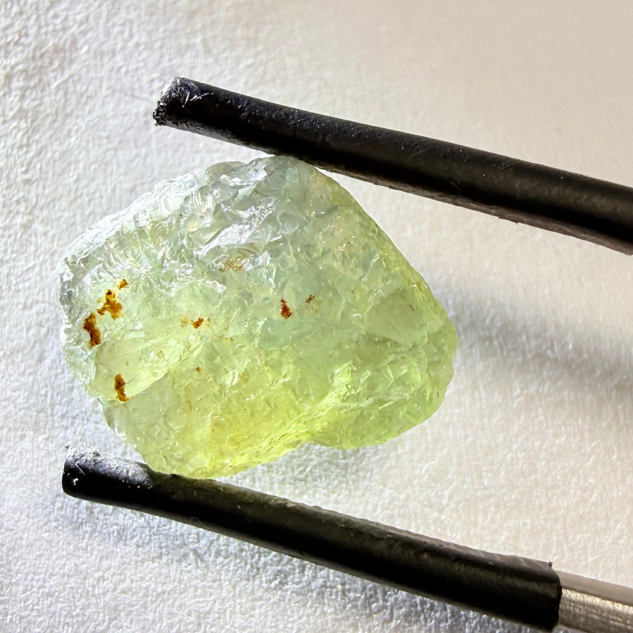 Umba Sapphire, 14.72ct, Umba Valley, Tanzania, Untreated Unheated. Slightly to moderately included,  slight silk, crack going a 1/4 way in. See the backlit pics  I have circled the crack, minor fissures to be removed before faceting