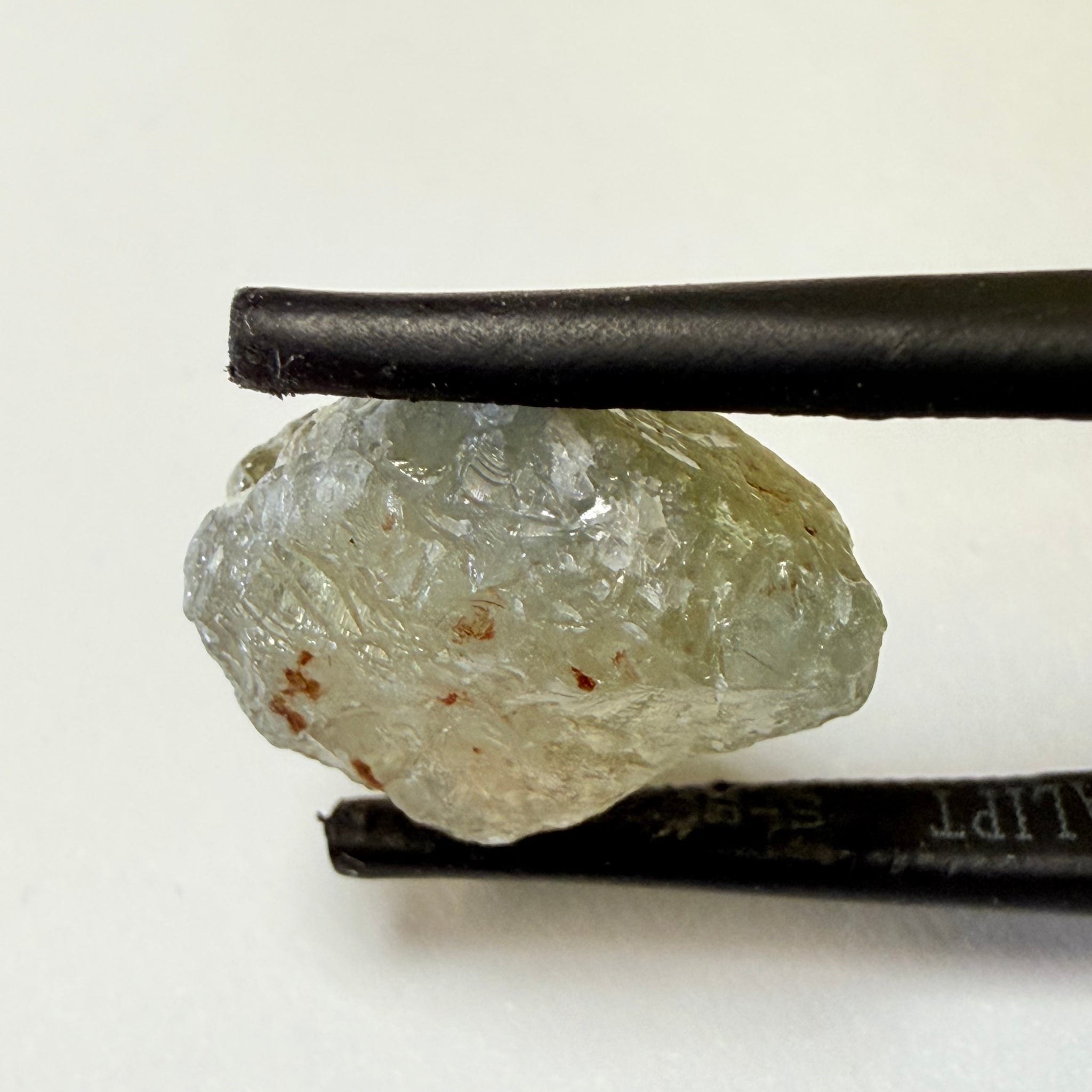 Umba Sapphire, 14.72ct, Umba Valley, Tanzania, Untreated Unheated. Slightly to moderately included,  slight silk, crack going a 1/4 way in. See the backlit pics  I have circled the crack, minor fissures to be removed before faceting