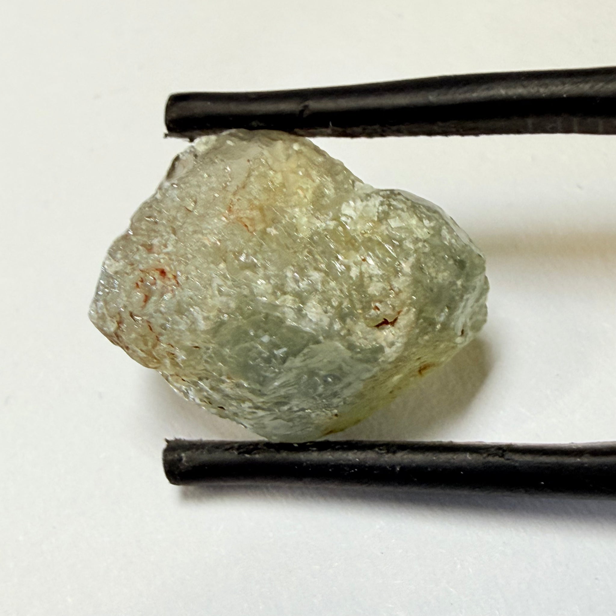 Umba Sapphire, 14.72ct, Umba Valley, Tanzania, Untreated Unheated. Slightly to moderately included,  slight silk, crack going a 1/4 way in. See the backlit pics  I have circled the crack, minor fissures to be removed before faceting