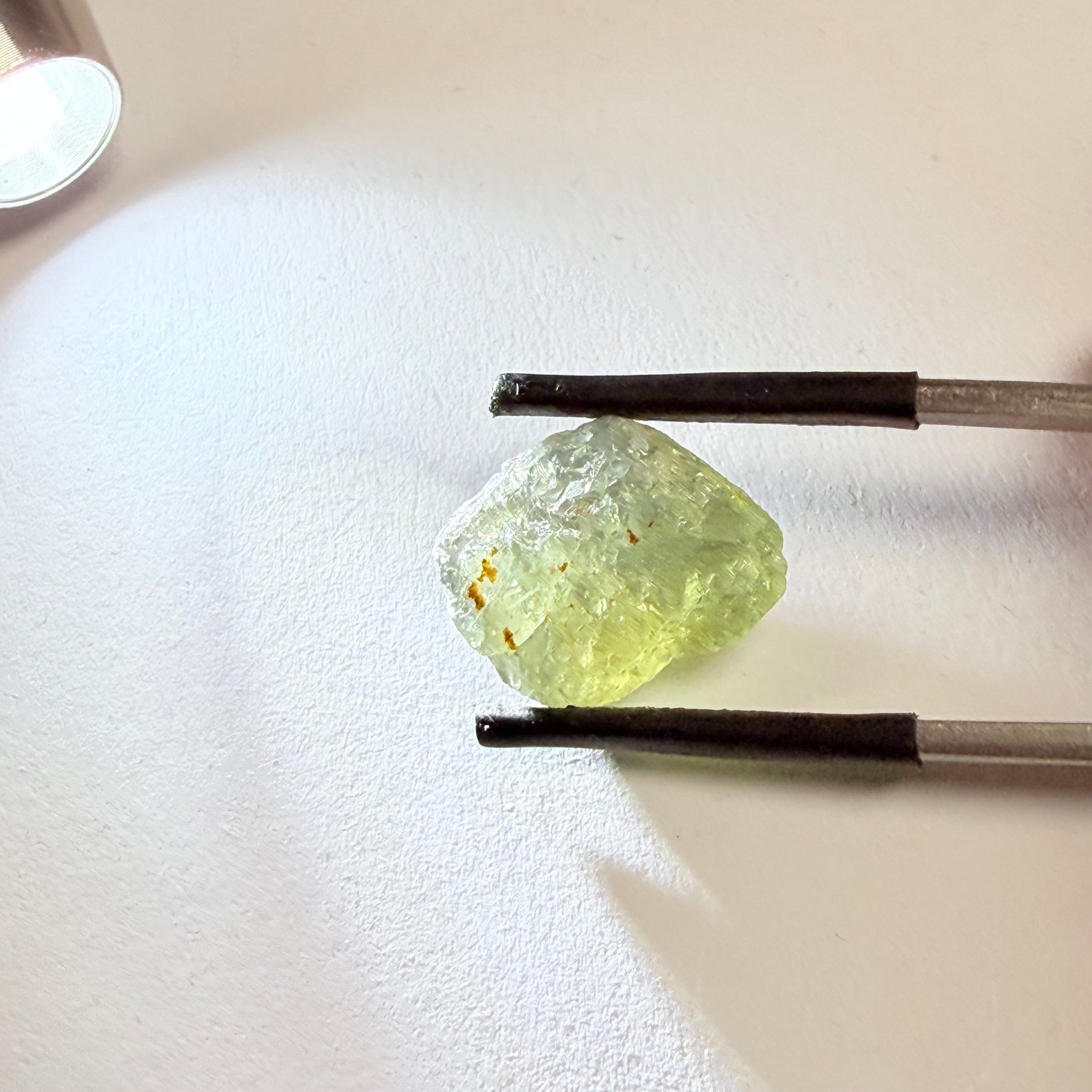 Umba Sapphire, 14.72ct, Umba Valley, Tanzania, Untreated Unheated. Slightly to moderately included,  slight silk, crack going a 1/4 way in. See the backlit pics  I have circled the crack, minor fissures to be removed before faceting