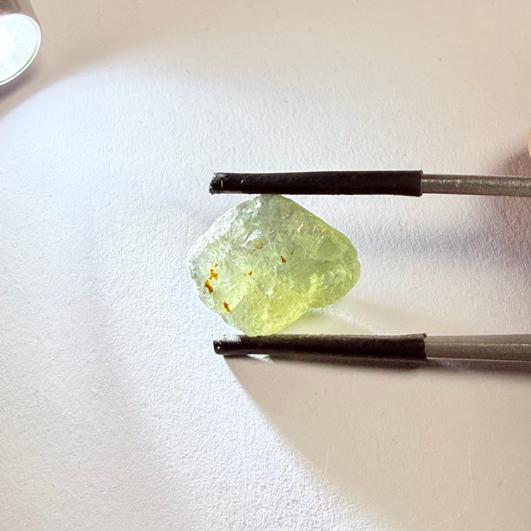 Umba Sapphire, 14.72ct, Umba Valley, Tanzania, Untreated Unheated. Slightly to moderately included,  slight silk, crack going a 1/4 way in. See the backlit pics  I have circled the crack, minor fissures to be removed before faceting