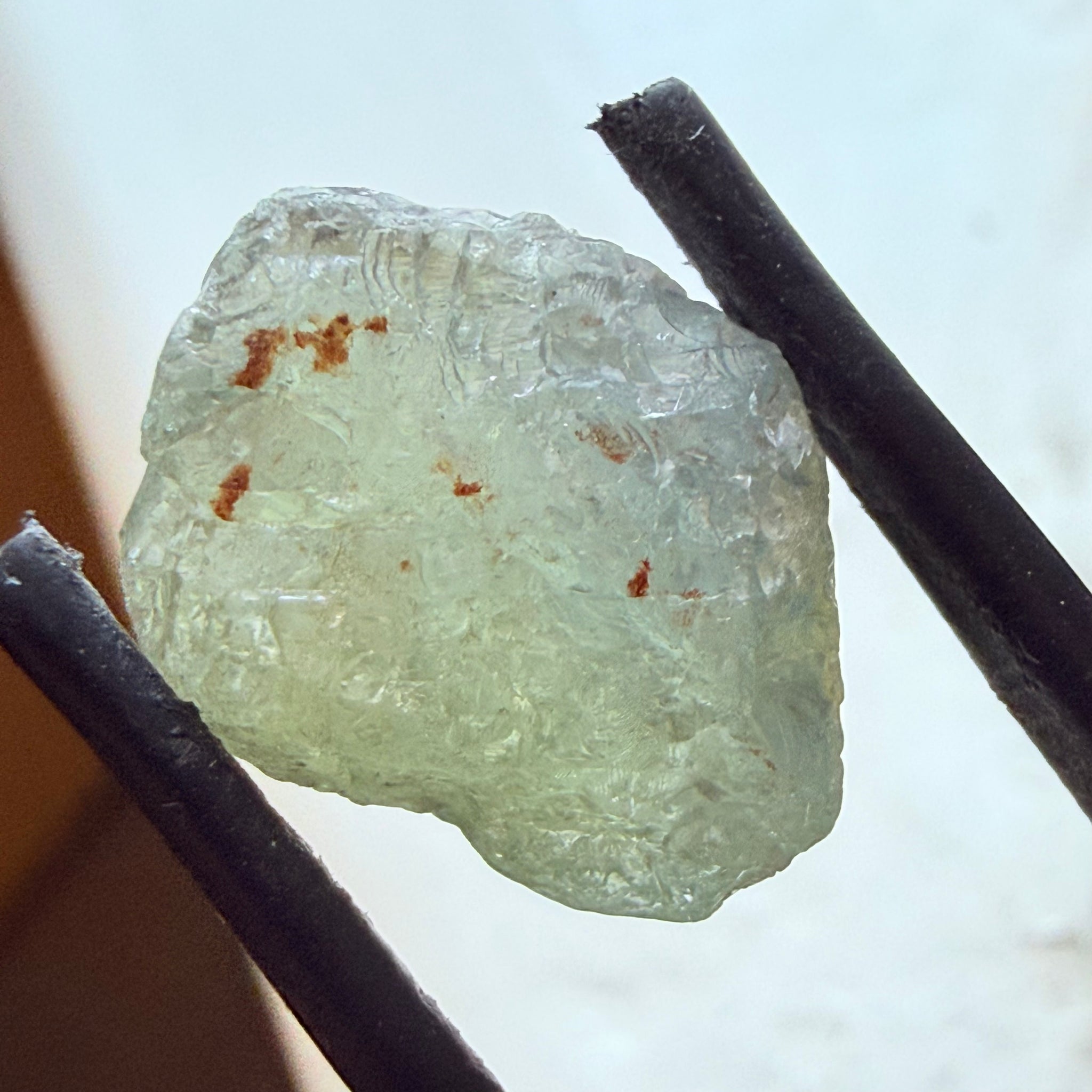 Umba Sapphire, 14.72ct, Umba Valley, Tanzania, Untreated Unheated. Slightly to moderately included,  slight silk, crack going a 1/4 way in. See the backlit pics  I have circled the crack, minor fissures to be removed before faceting