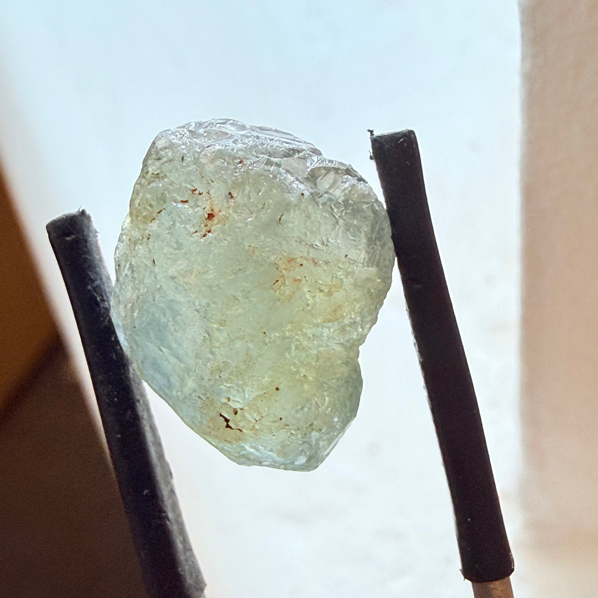 Umba Sapphire, 14.72ct, Umba Valley, Tanzania, Untreated Unheated. Slightly to moderately included,  slight silk, crack going a 1/4 way in. See the backlit pics  I have circled the crack, minor fissures to be removed before faceting