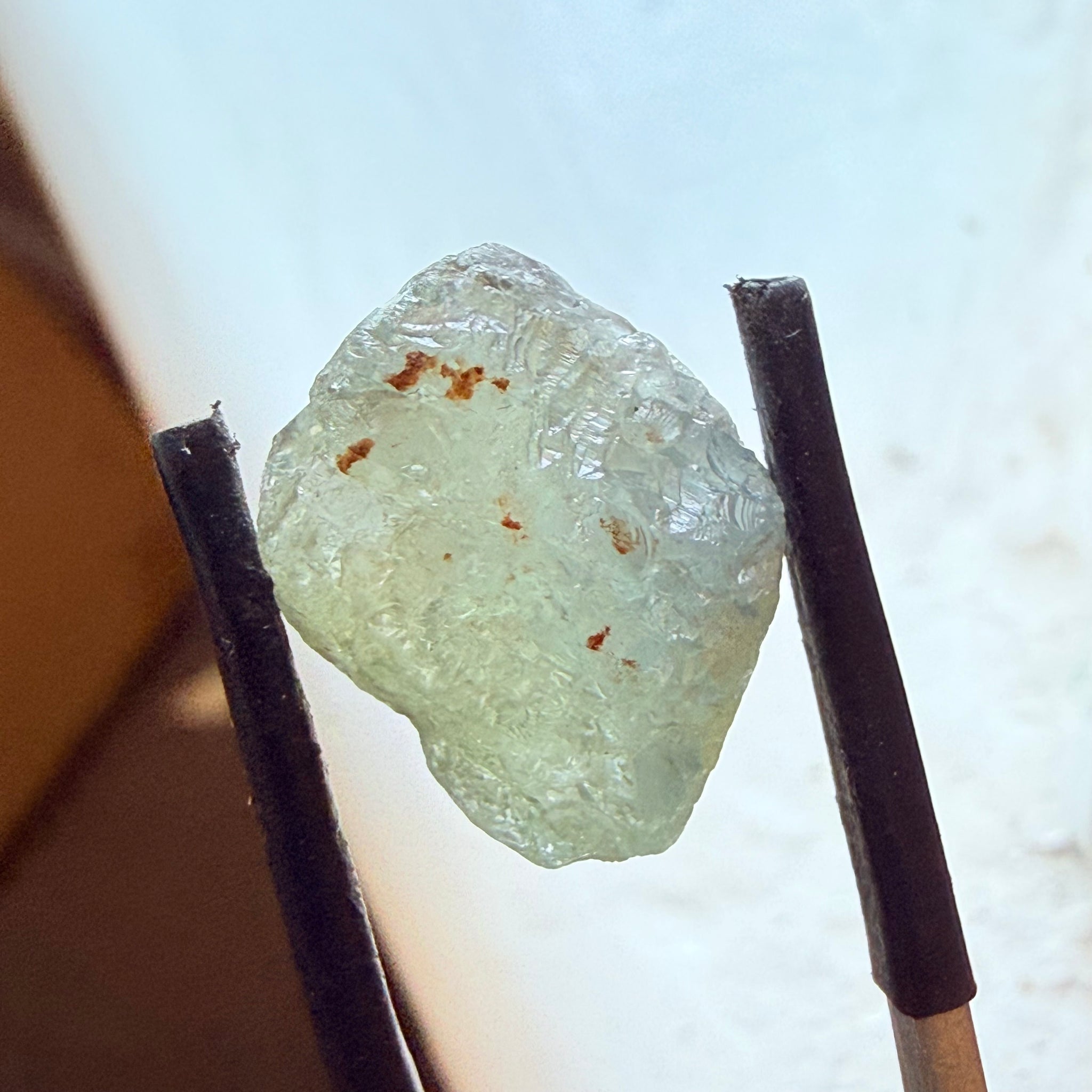Umba Sapphire, 14.72ct, Umba Valley, Tanzania, Untreated Unheated. Slightly to moderately included,  slight silk, crack going a 1/4 way in. See the backlit pics  I have circled the crack, minor fissures to be removed before faceting