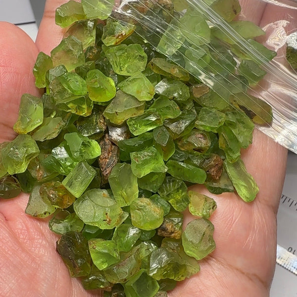 Peridot Lot, 110.10gm / 550.50ct, Mined by the Wa GoGo tribe in Tanzania, Unheated Untreated, av size 3.60ct, mostly flatter shapes, see the video with sunlight coming in