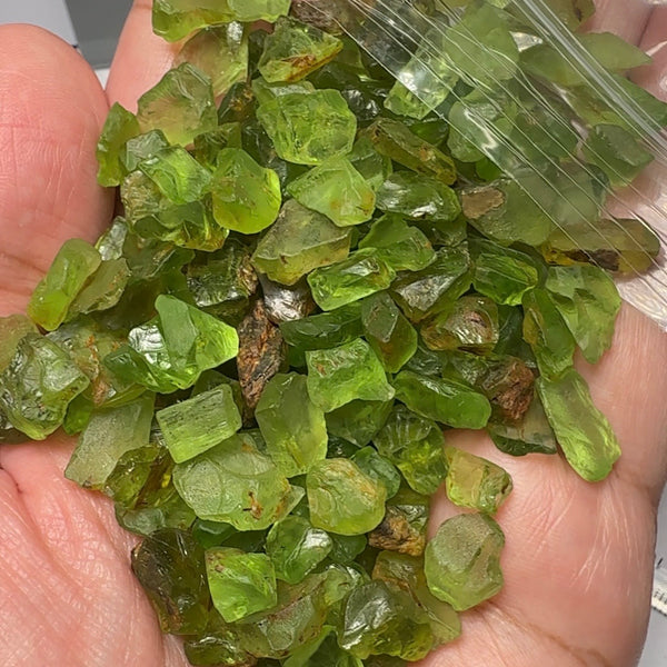 Peridot Lot, 110.10gm / 550.50ct, Mined by the Wa GoGo tribe in Tanzania, Unheated Untreated, av size 3.60ct, mostly flatter shapes, see the video with sunlight coming in