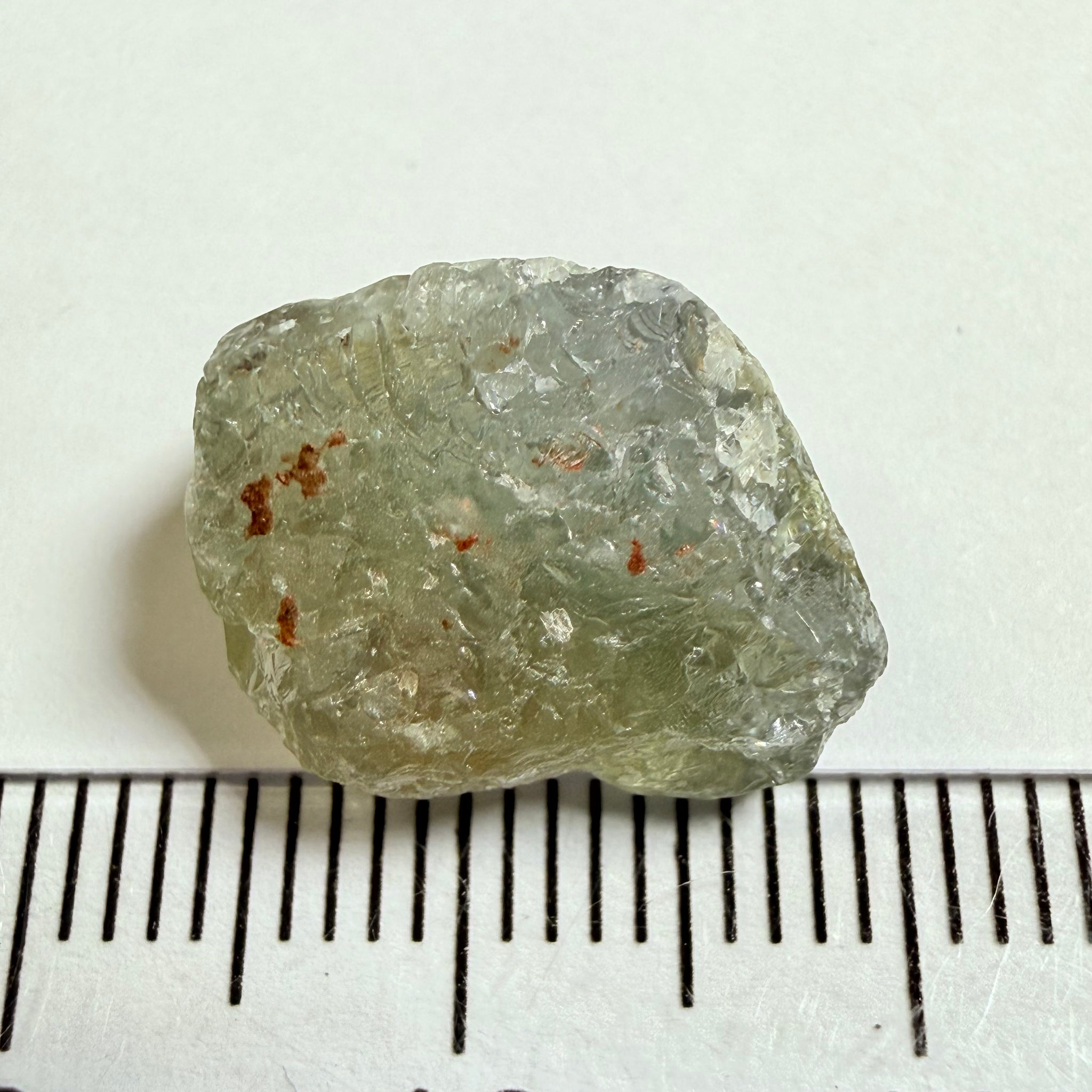 Umba Sapphire, 14.72ct, Umba Valley, Tanzania, Untreated Unheated. Slightly to moderately included,  slight silk, crack going a 1/4 way in. See the backlit pics  I have circled the crack, minor fissures to be removed before faceting