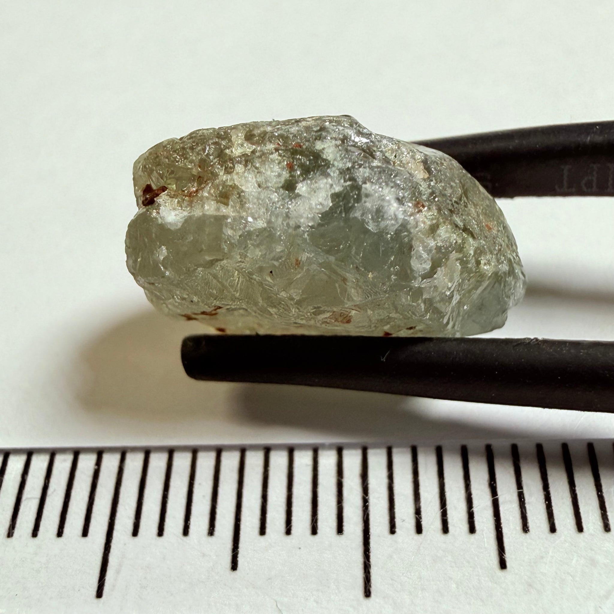 Umba Sapphire, 14.72ct, Umba Valley, Tanzania, Untreated Unheated. Slightly to moderately included,  slight silk, crack going a 1/4 way in. See the backlit pics  I have circled the crack, minor fissures to be removed before faceting