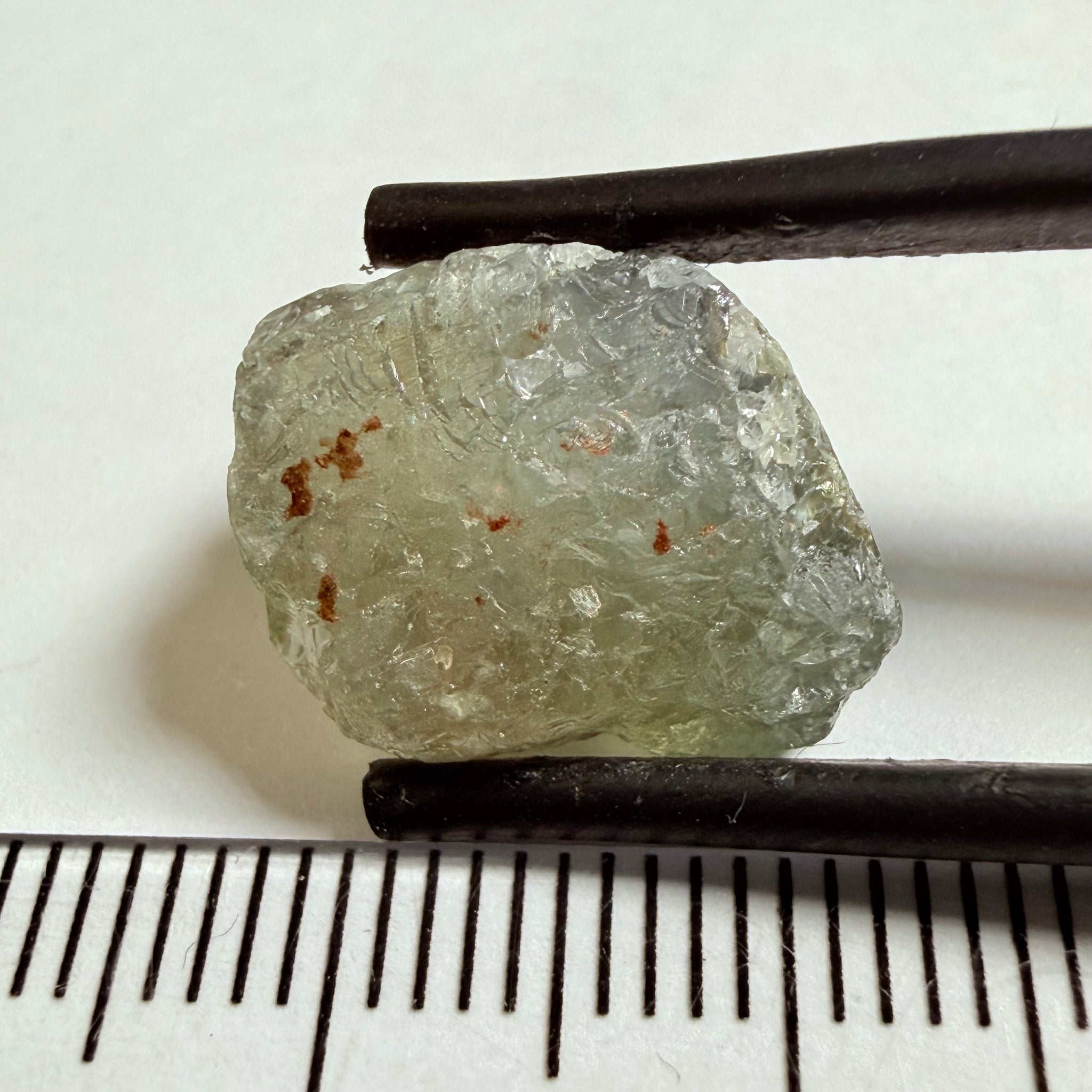 Umba Sapphire, 14.72ct, Umba Valley, Tanzania, Untreated Unheated. Slightly to moderately included,  slight silk, crack going a 1/4 way in. See the backlit pics  I have circled the crack, minor fissures to be removed before faceting