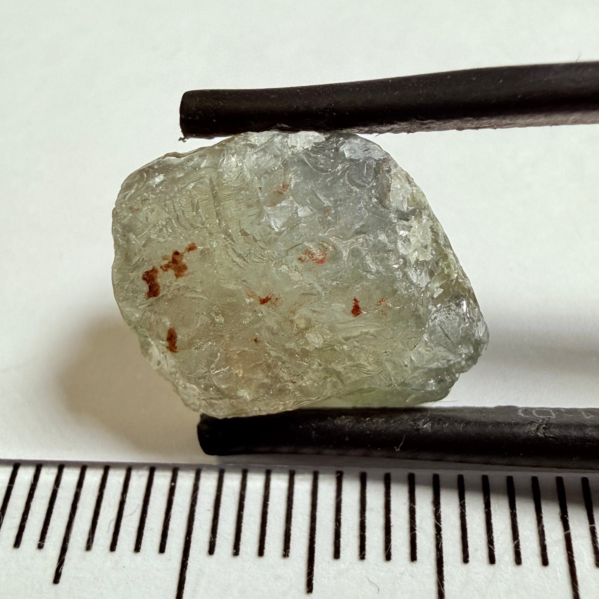 Umba Sapphire, 14.72ct, Umba Valley, Tanzania, Untreated Unheated. Slightly to moderately included,  slight silk, crack going a 1/4 way in. See the backlit pics  I have circled the crack, minor fissures to be removed before faceting