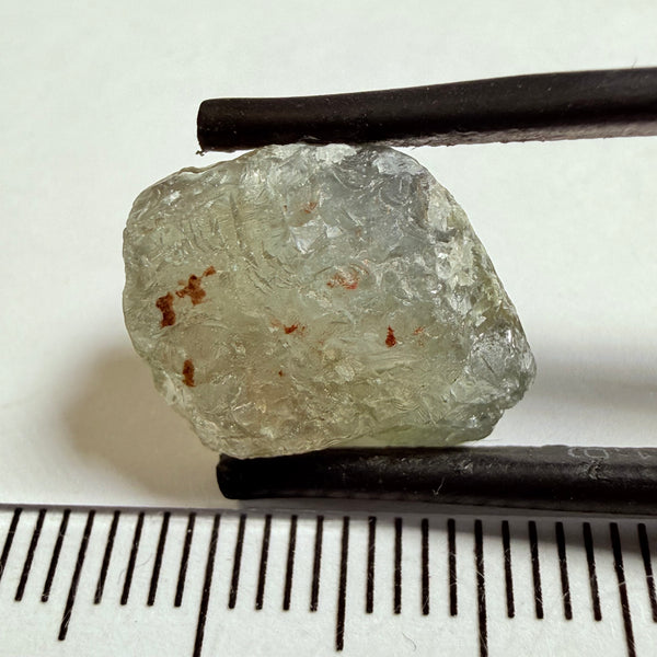 Umba Sapphire, 14.72ct, Umba Valley, Tanzania, Untreated Unheated. Slightly to moderately included,  slight silk, crack going a 1/4 way in. See the backlit pics  I have circled the crack, minor fissures to be removed before faceting