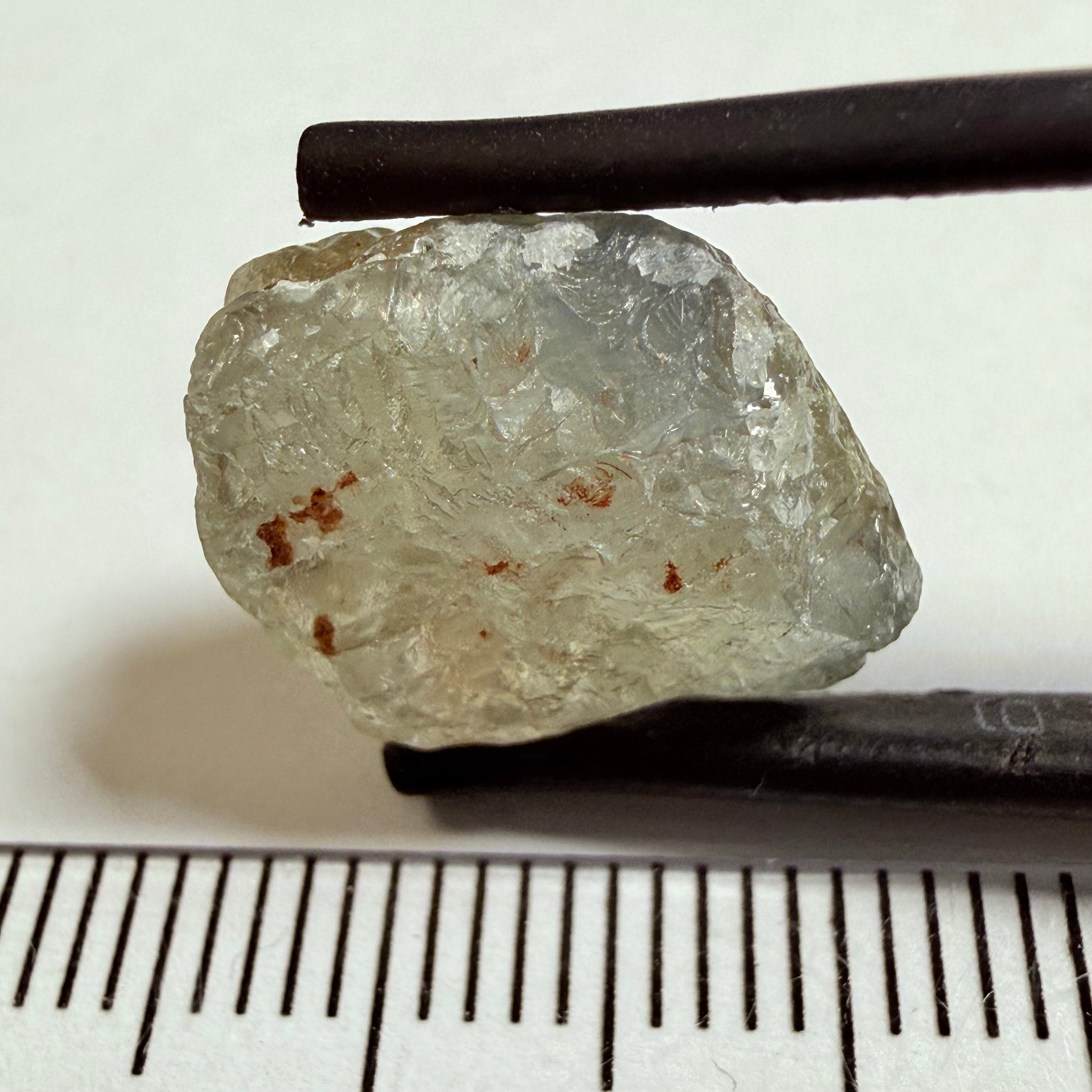 Umba Sapphire, 14.72ct, Umba Valley, Tanzania, Untreated Unheated. Slightly to moderately included,  slight silk, crack going a 1/4 way in. See the backlit pics  I have circled the crack, minor fissures to be removed before faceting
