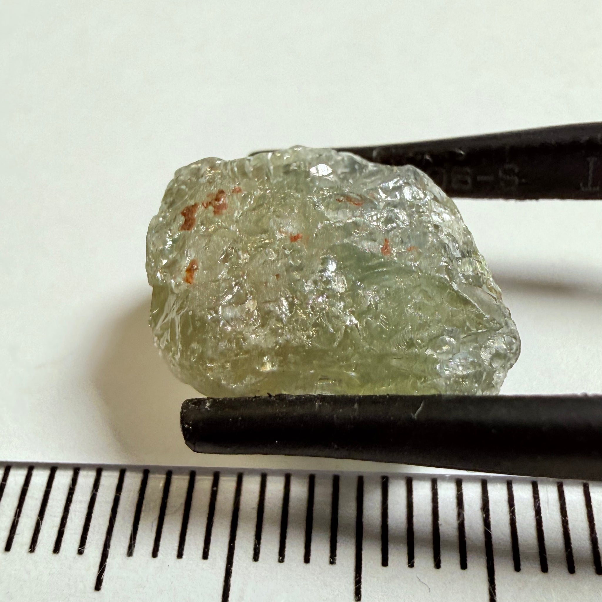 Umba Sapphire, 14.72ct, Umba Valley, Tanzania, Untreated Unheated. Slightly to moderately included,  slight silk, crack going a 1/4 way in. See the backlit pics  I have circled the crack, minor fissures to be removed before faceting