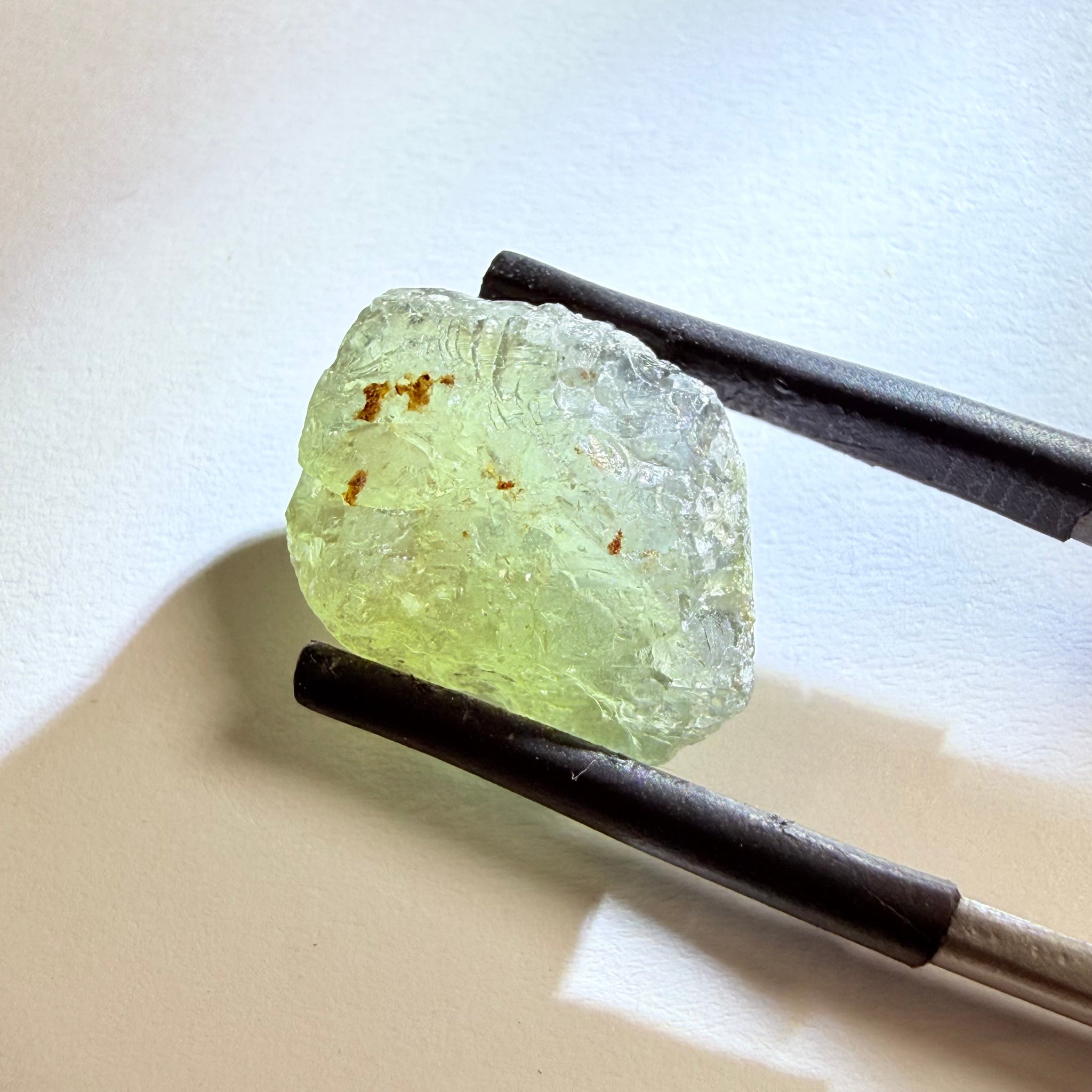 Umba Sapphire, 14.72ct, Umba Valley, Tanzania, Untreated Unheated. Slightly to moderately included,  slight silk, crack going a 1/4 way in. See the backlit pics  I have circled the crack, minor fissures to be removed before faceting