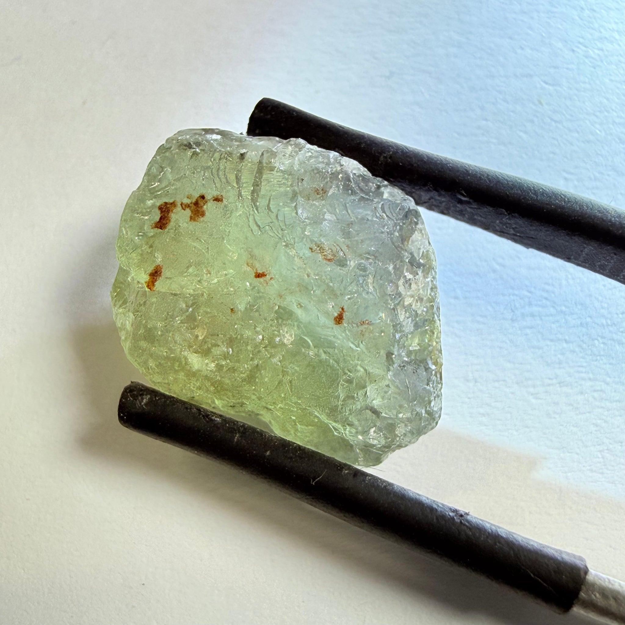 Umba Sapphire, 14.72ct, Umba Valley, Tanzania, Untreated Unheated. Slightly to moderately included,  slight silk, crack going a 1/4 way in. See the backlit pics  I have circled the crack, minor fissures to be removed before faceting