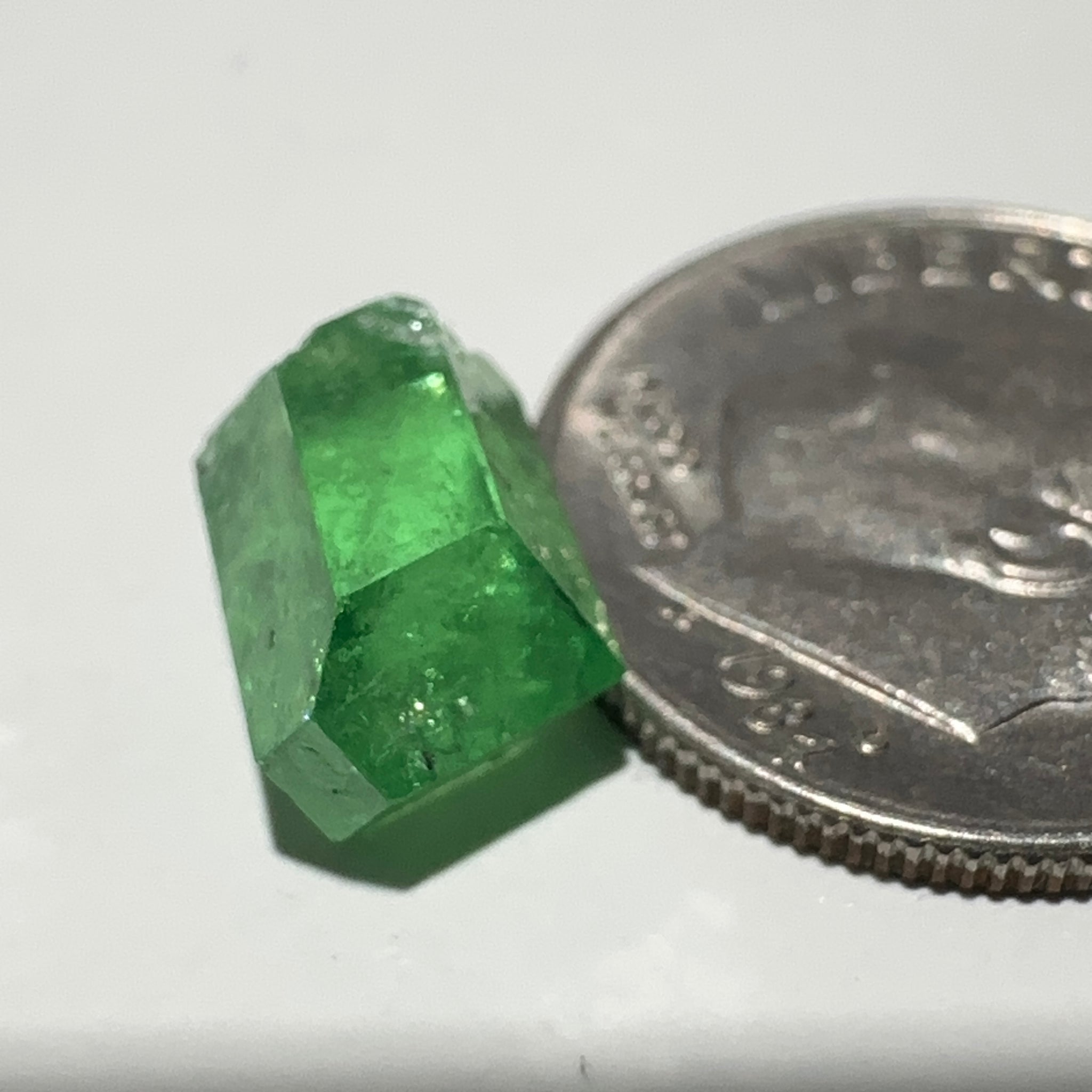 Tsavorite Garnet Crystal, 3.65ct A very unusual Tsavorite crystal from Merelani in Tanzania, Untreated Unheated, see the photos taken in different lights